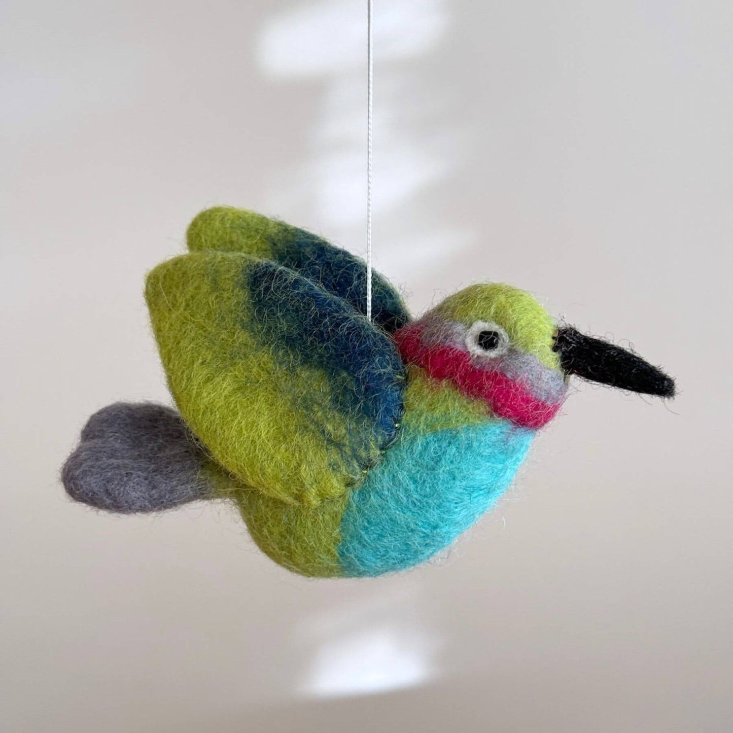 Close-up of Ganapati Crafts Co. Hummingbird Baby Mobile