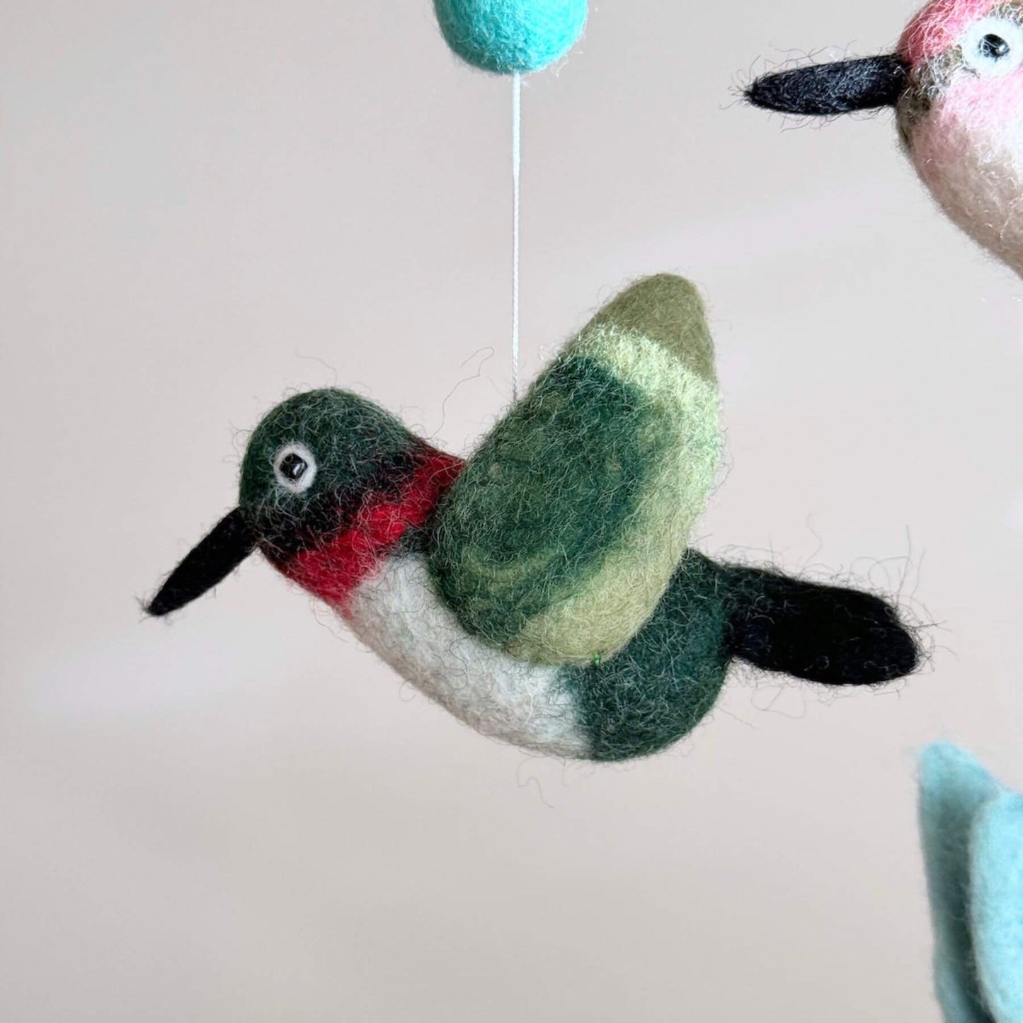 Close-up of Ganapati Crafts Co. Hummingbird Baby Mobile