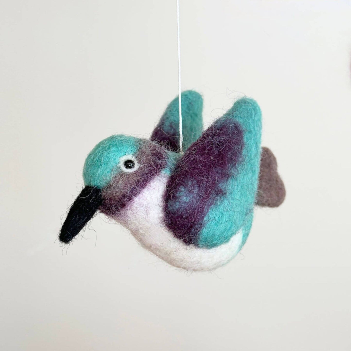 Close-up of Ganapati Crafts Co. Hummingbird Baby Mobile