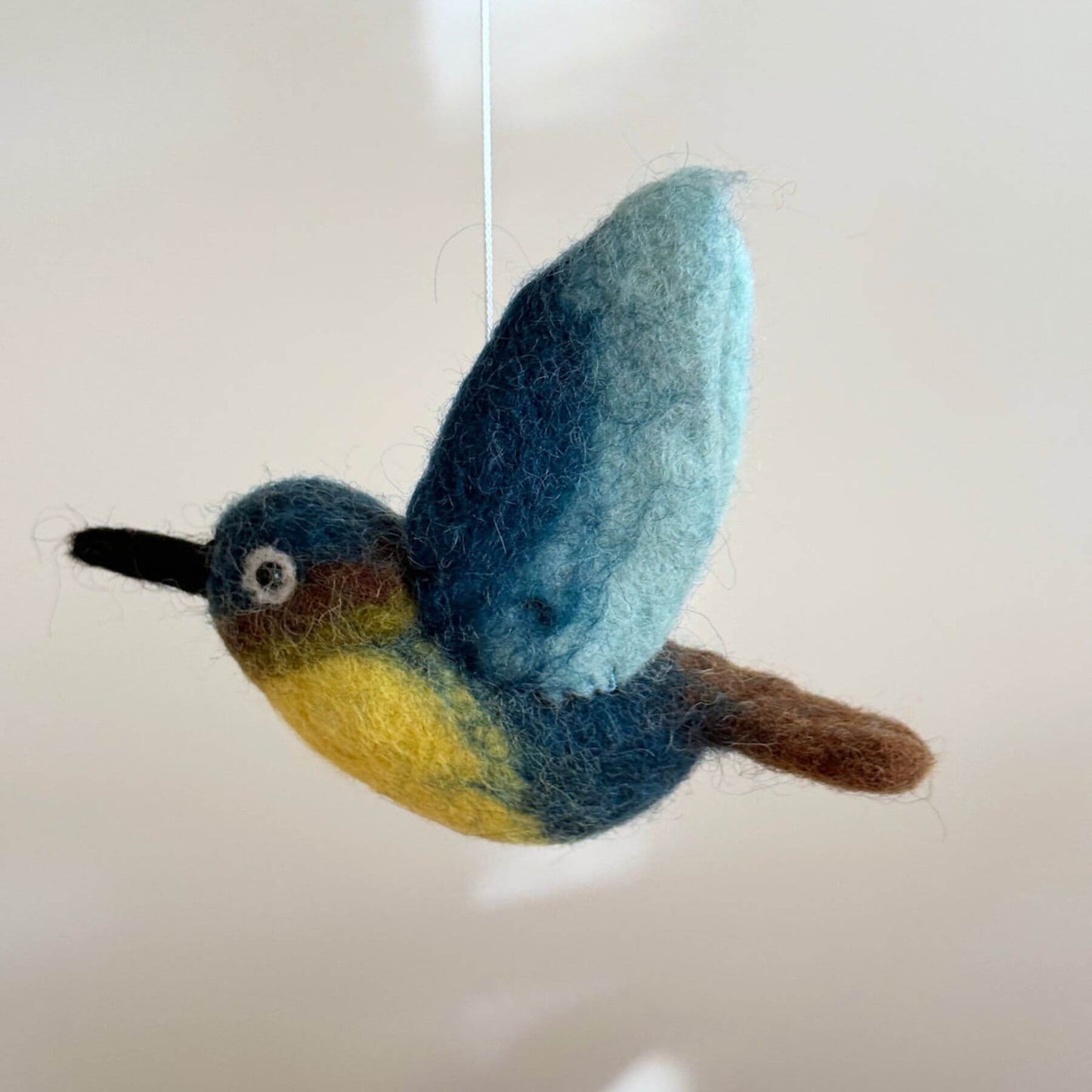 Close-up of Ganapati Crafts Co. Hummingbird Baby Mobile