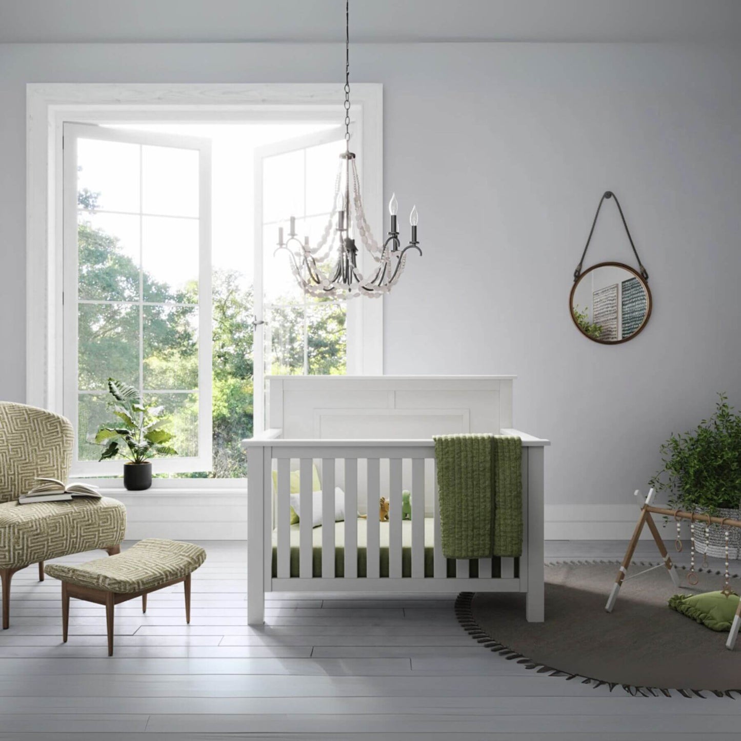 Nursery room with a "Just White" OG 4-in-1 Convertible Crib, green blanket, and decorative elements.