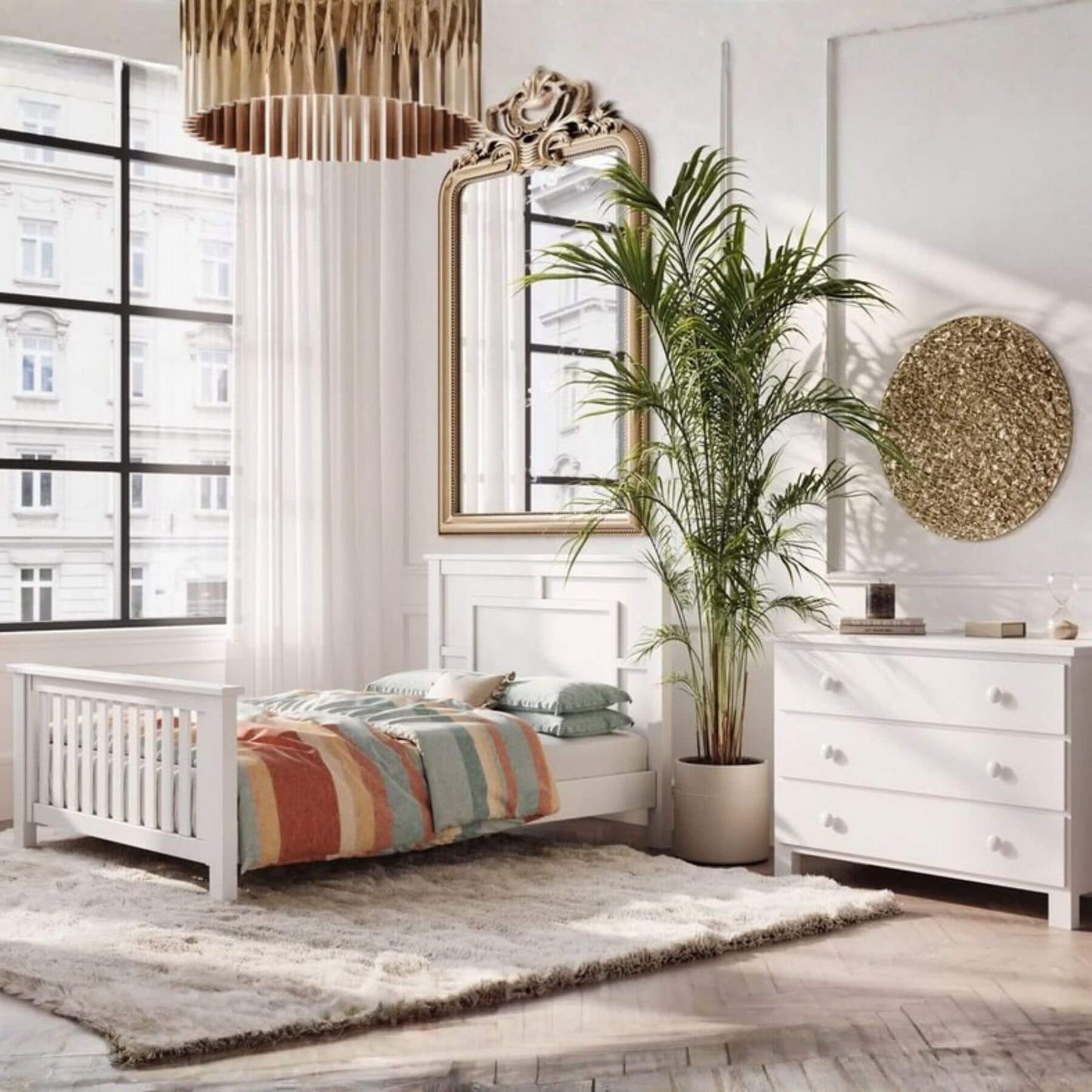 Modern bedroom with white furniture, colorful bedding, and decorative elements.