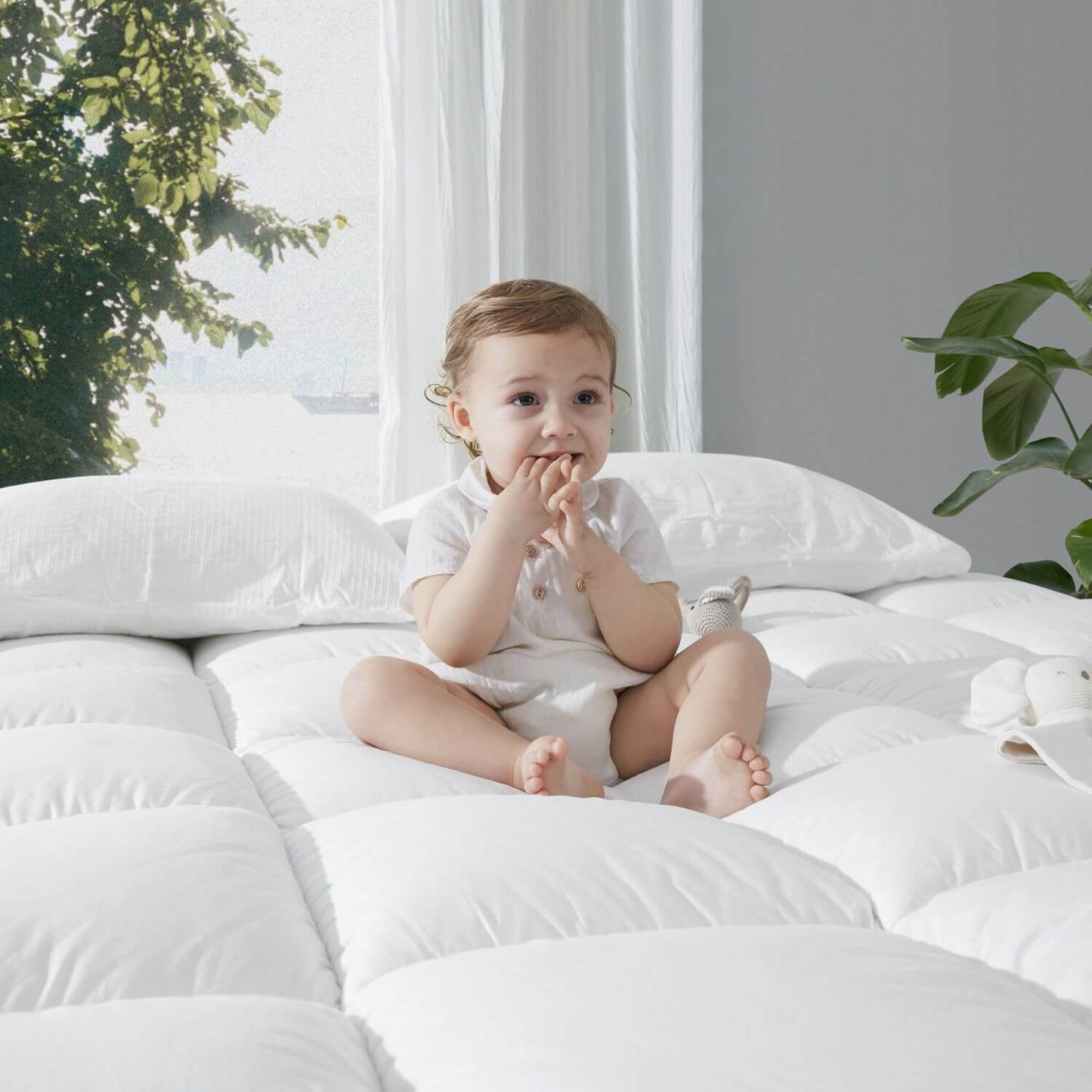 Baby Sitting on KUB Cooling Mattress Topper White