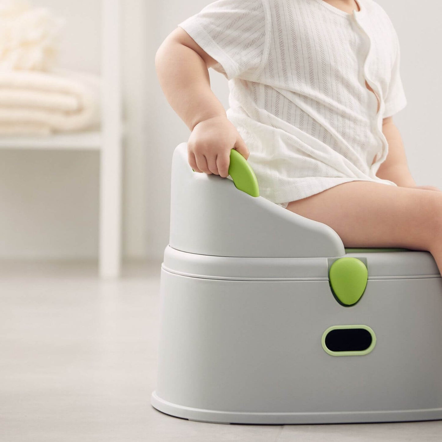 Baby Sitting on KUB Potty Training Toilet Grey