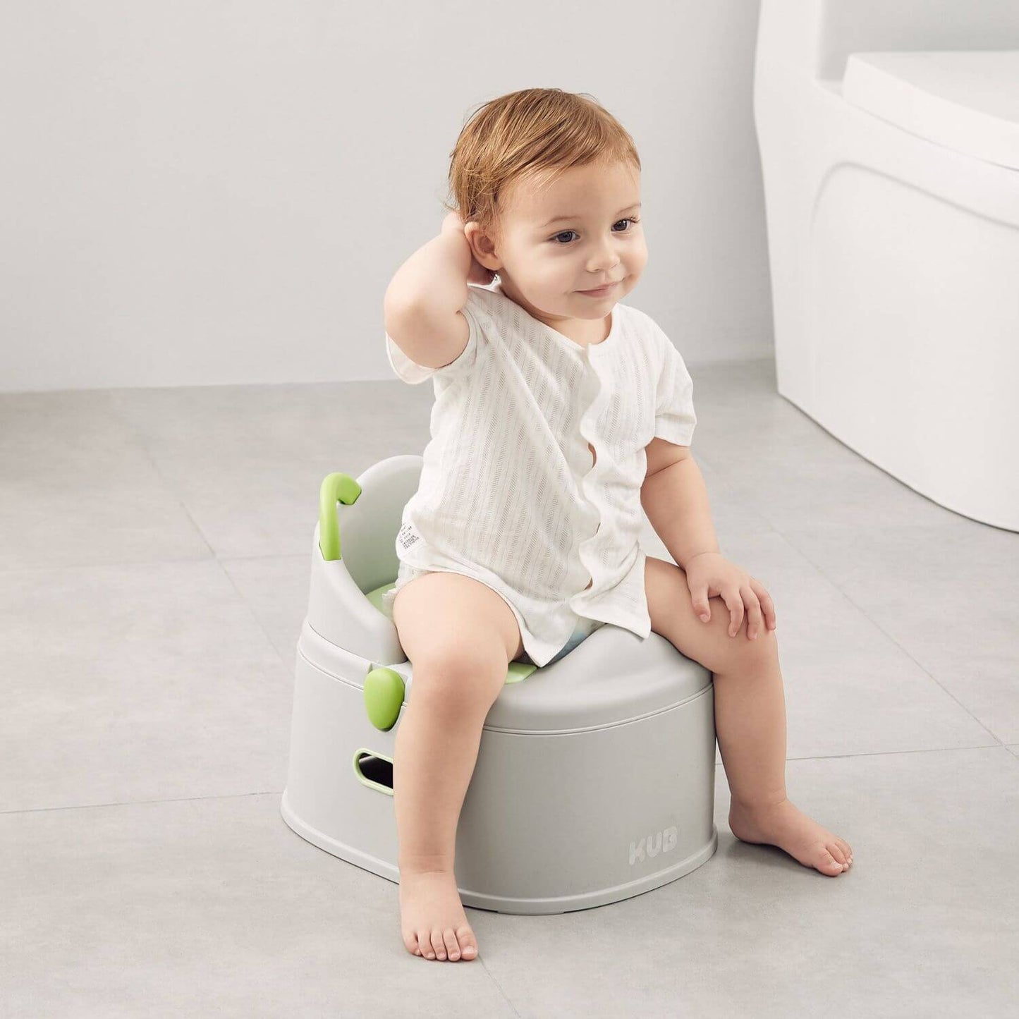 Baby Sitting on KUB Potty Training Toilet Grey
