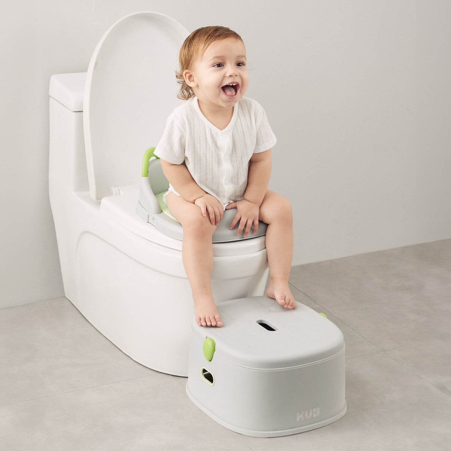 Baby Sitting on Toilet, Stepping on KUB Potty Training Toilet Grey