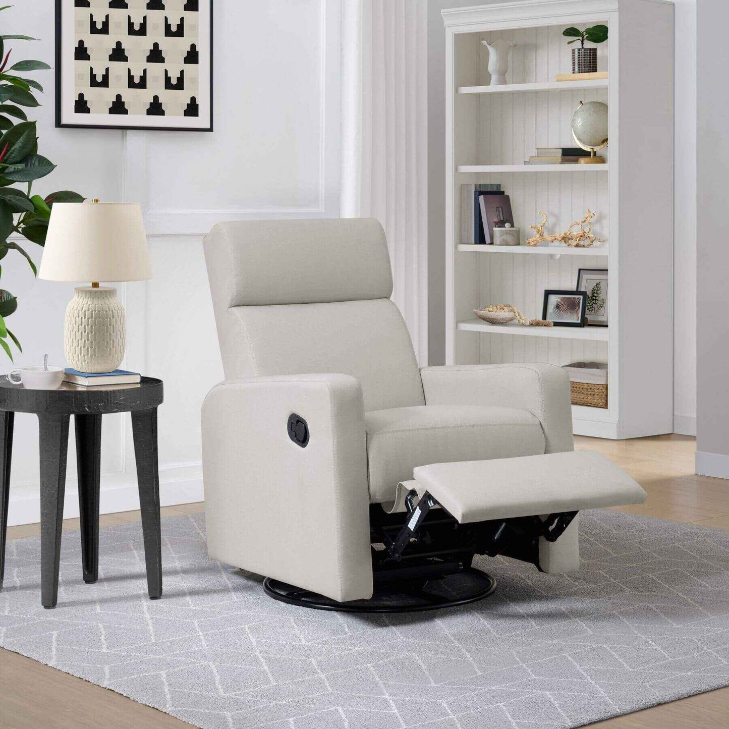 Oxford Baby Layton Glider / Recliner Oatmeal in a living room setting with a side table and lamp.
