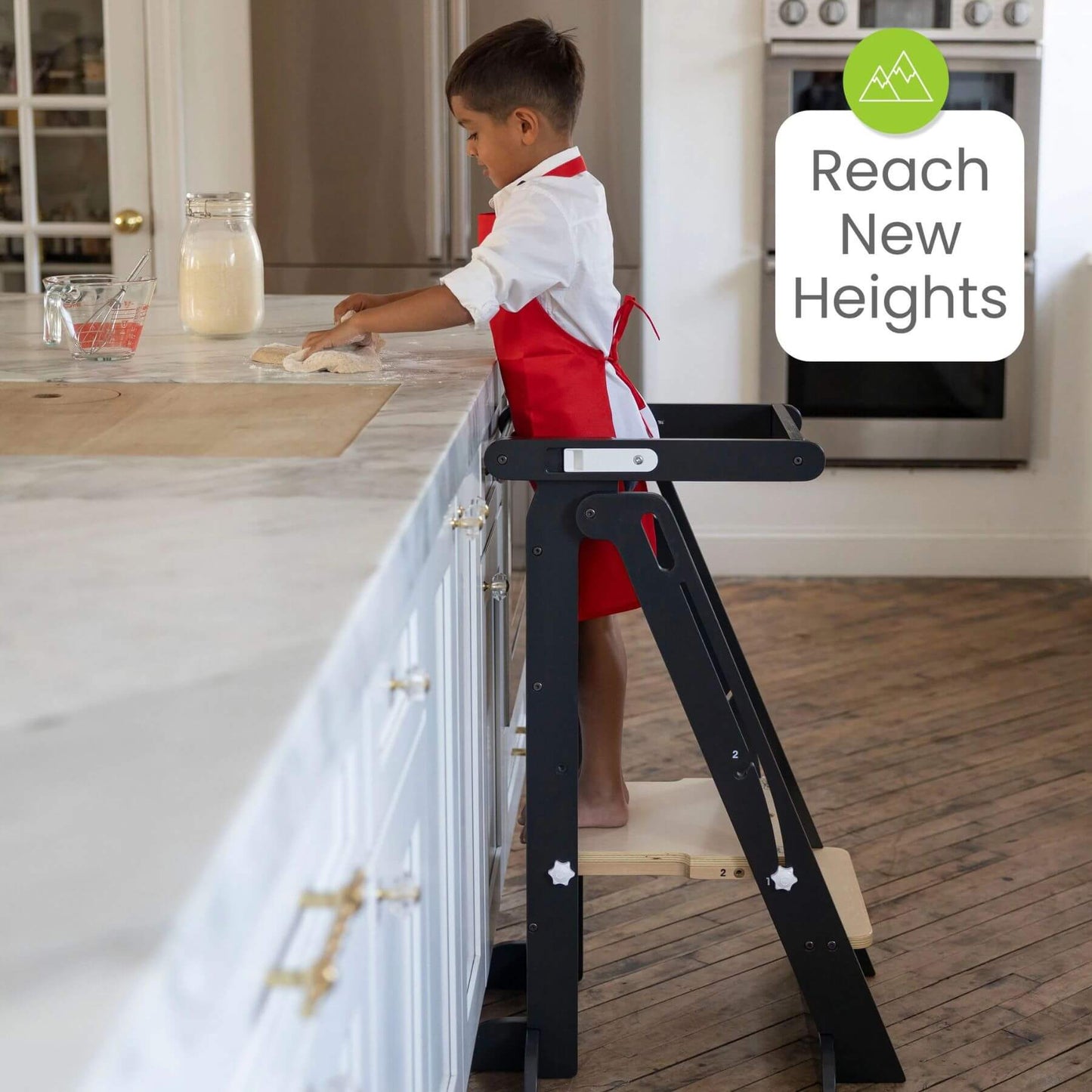 Boy Standing on Little Partners Learn 'N Fold Learning Tower Charcoal & Natural, Cooking