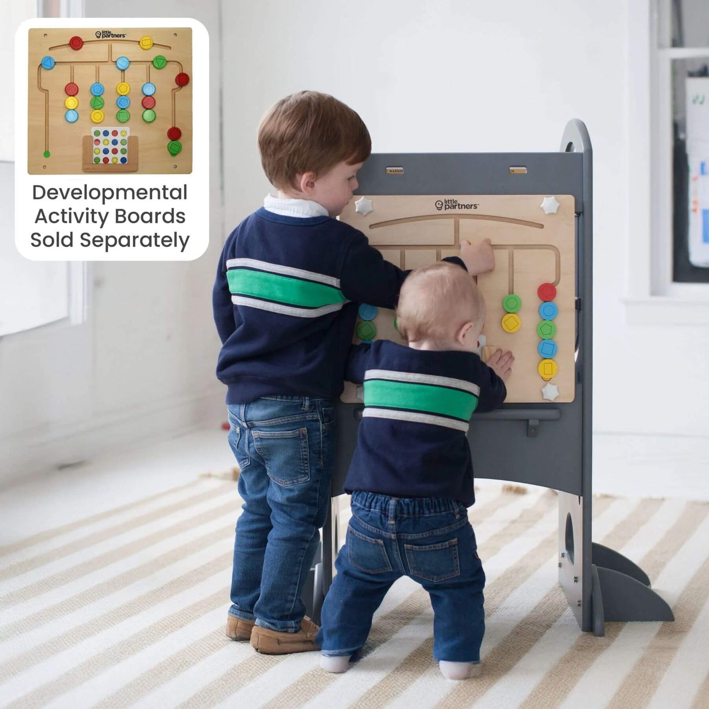Two Kids Playing Activity Boards attached to Little Partners Limited Edition Learning Tower Grey
