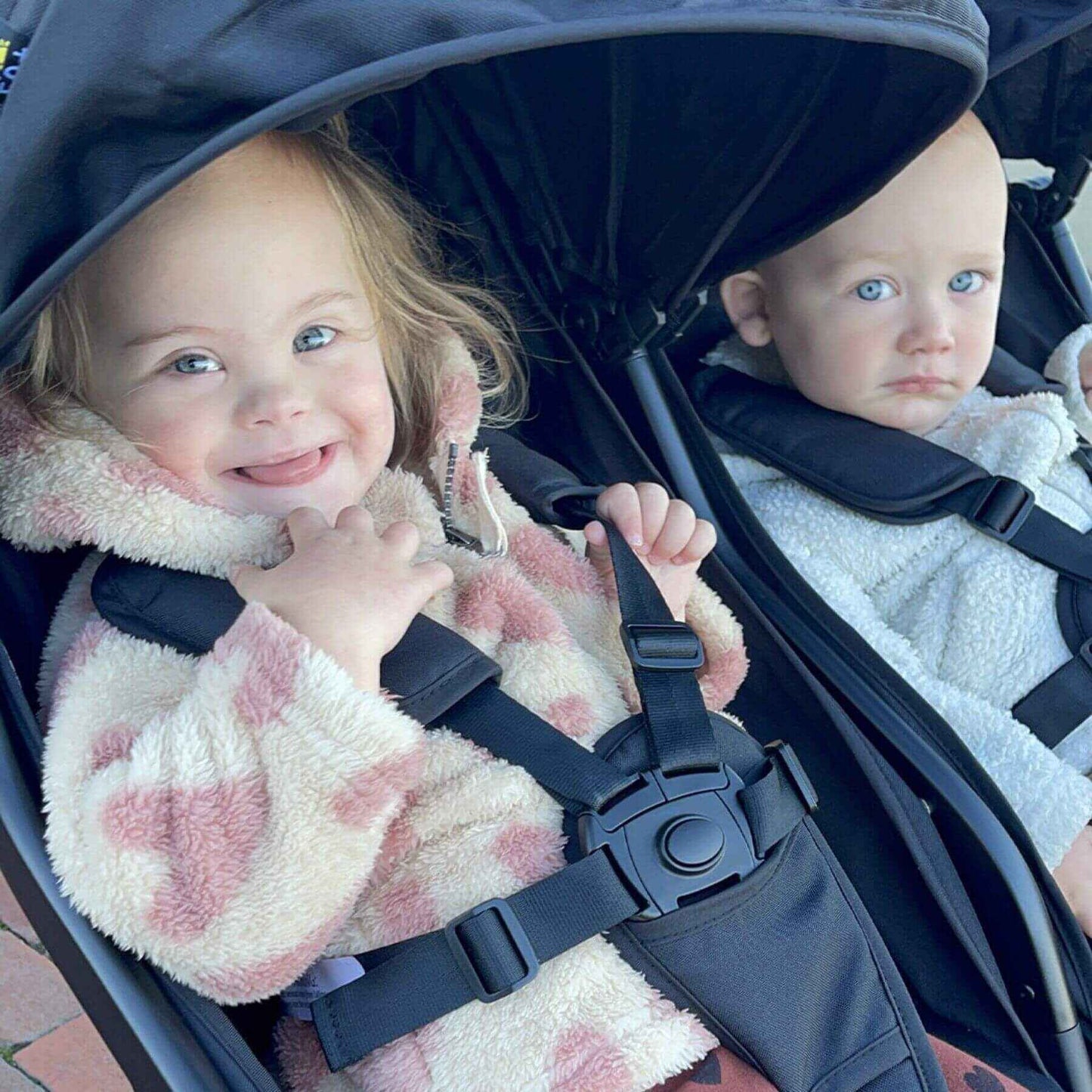 Babis Riding on Mompush Lithe Double Stroller Black