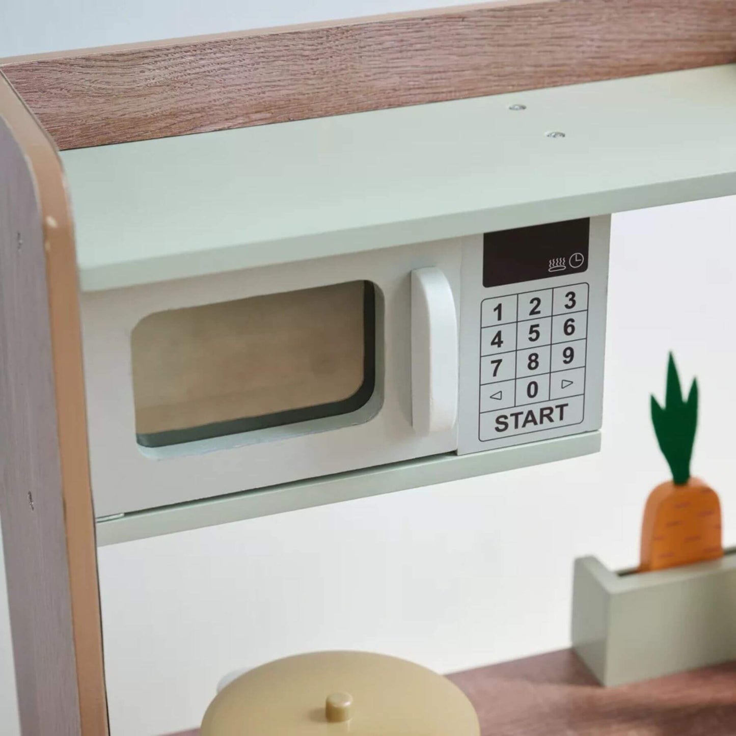 Children's toy microwave oven with wooden top and digital control panel on a white background