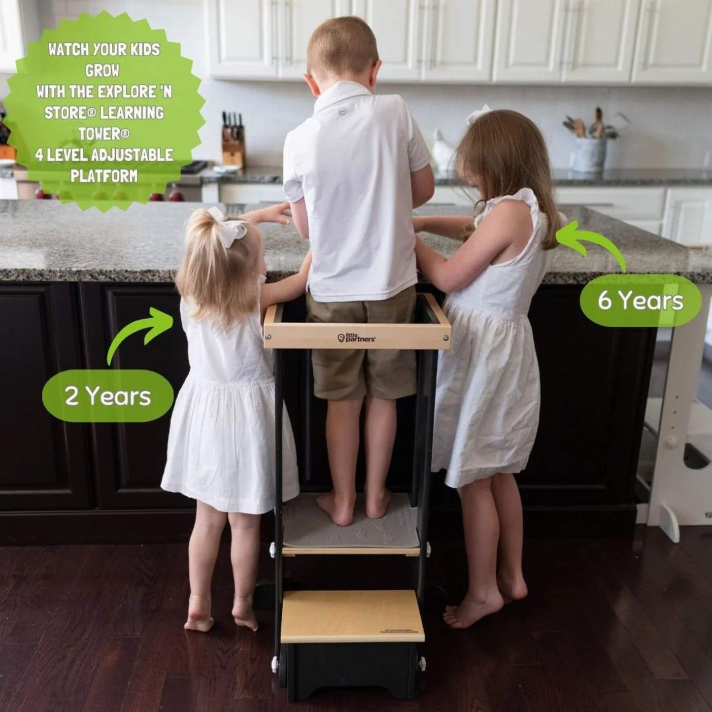 Boy Standing on Little Partners Explore 'N Store Learning Tower Charcoal & Natural, Pretend Cooking with Two Girls