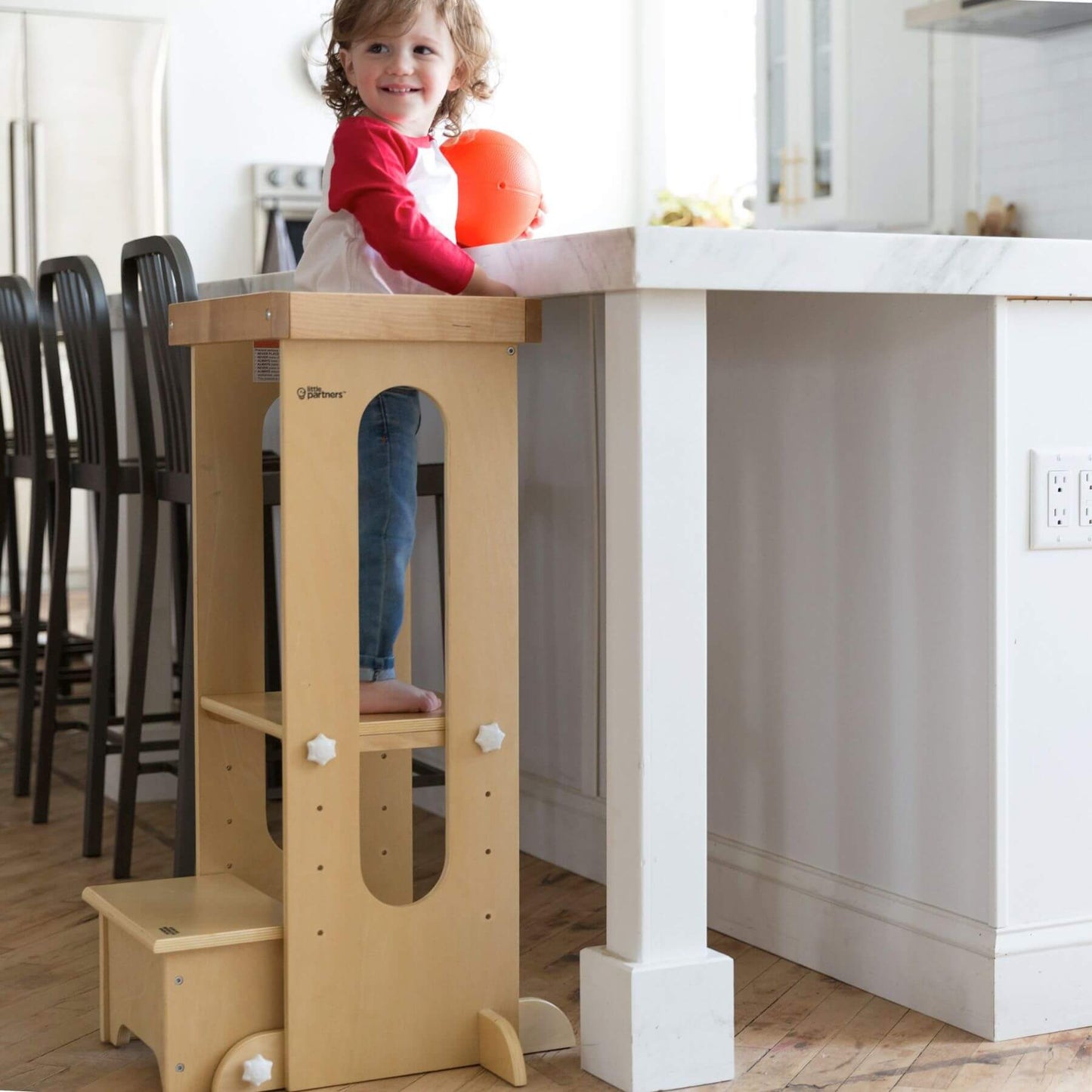 Girl Standing on Little Partners Explore 'N Store Learning Tower Natural