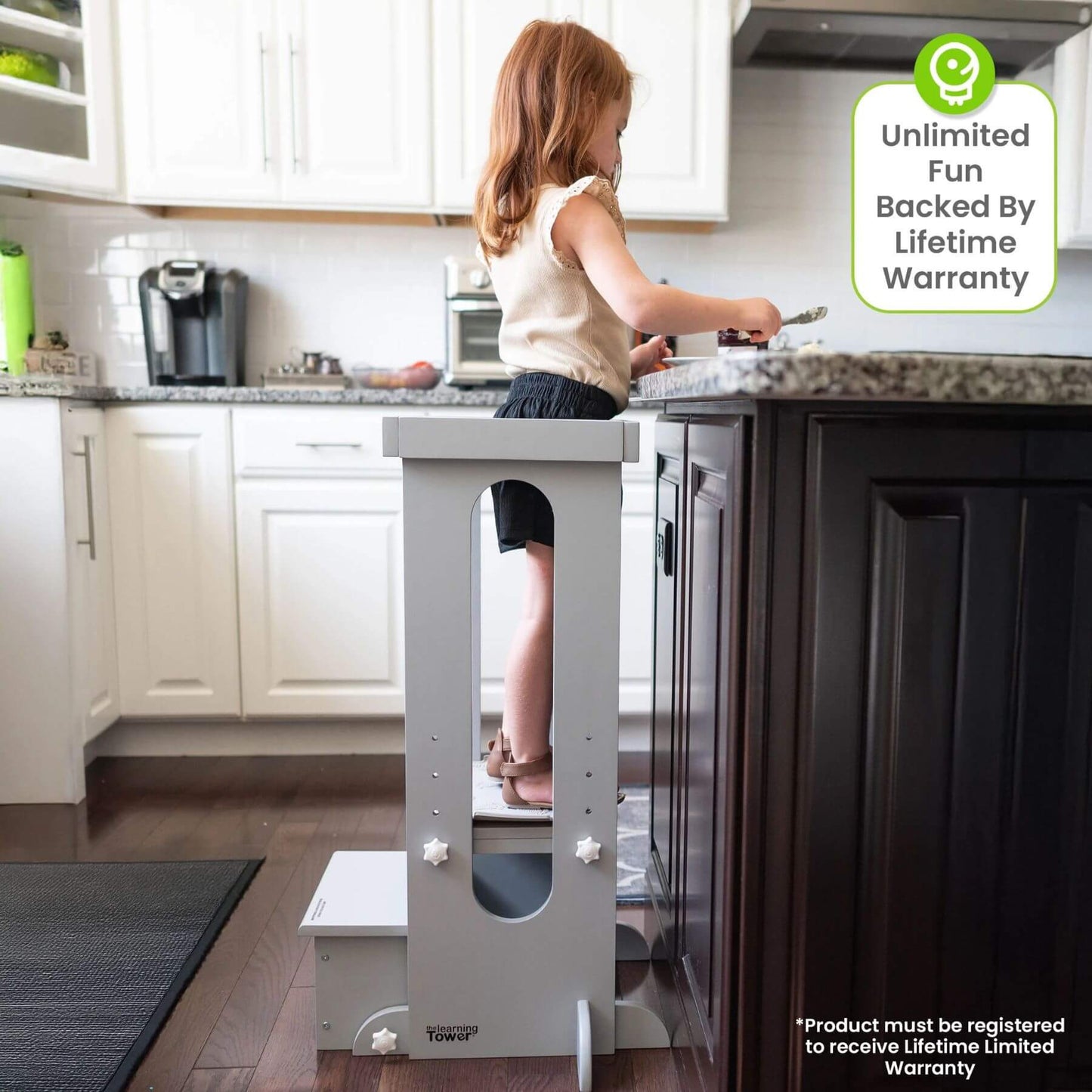 Girl Standing on Little Partners Explore 'N Store Learning Tower Silver