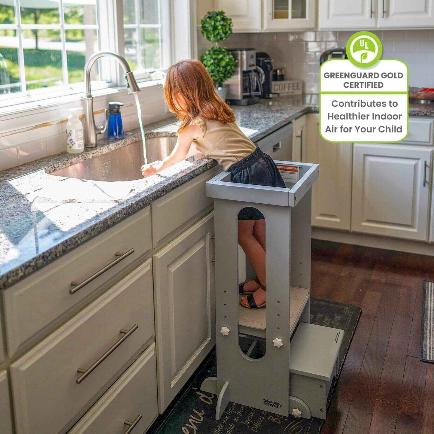 Girl Standing on Little Partners Explore 'N Store Learning Tower Silver, washing hands