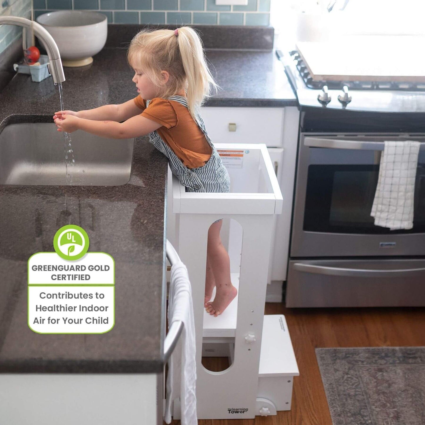 Girl Washing Hands on Little Partners Explore 'N Store Learning Tower White