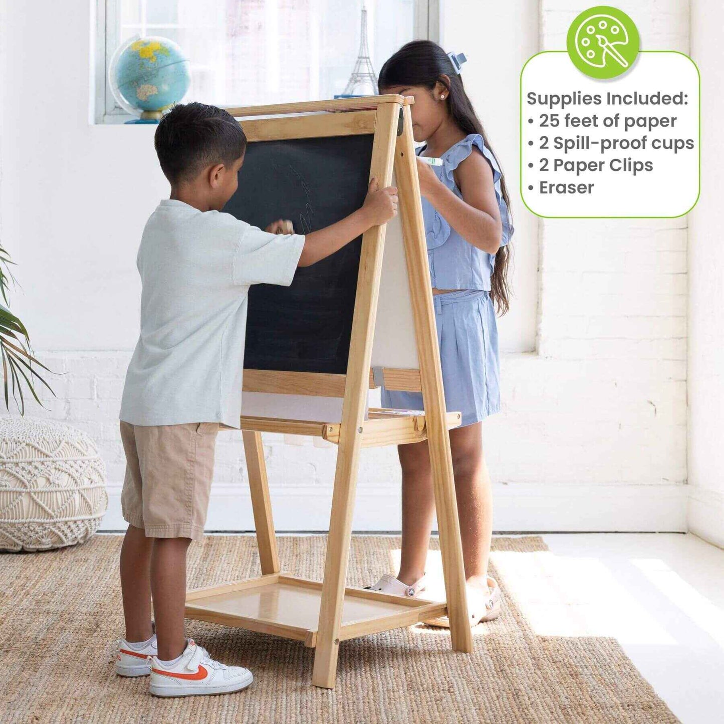 Two children using a Little Partners Folding Artist EZ Easel Natural in a bright room.