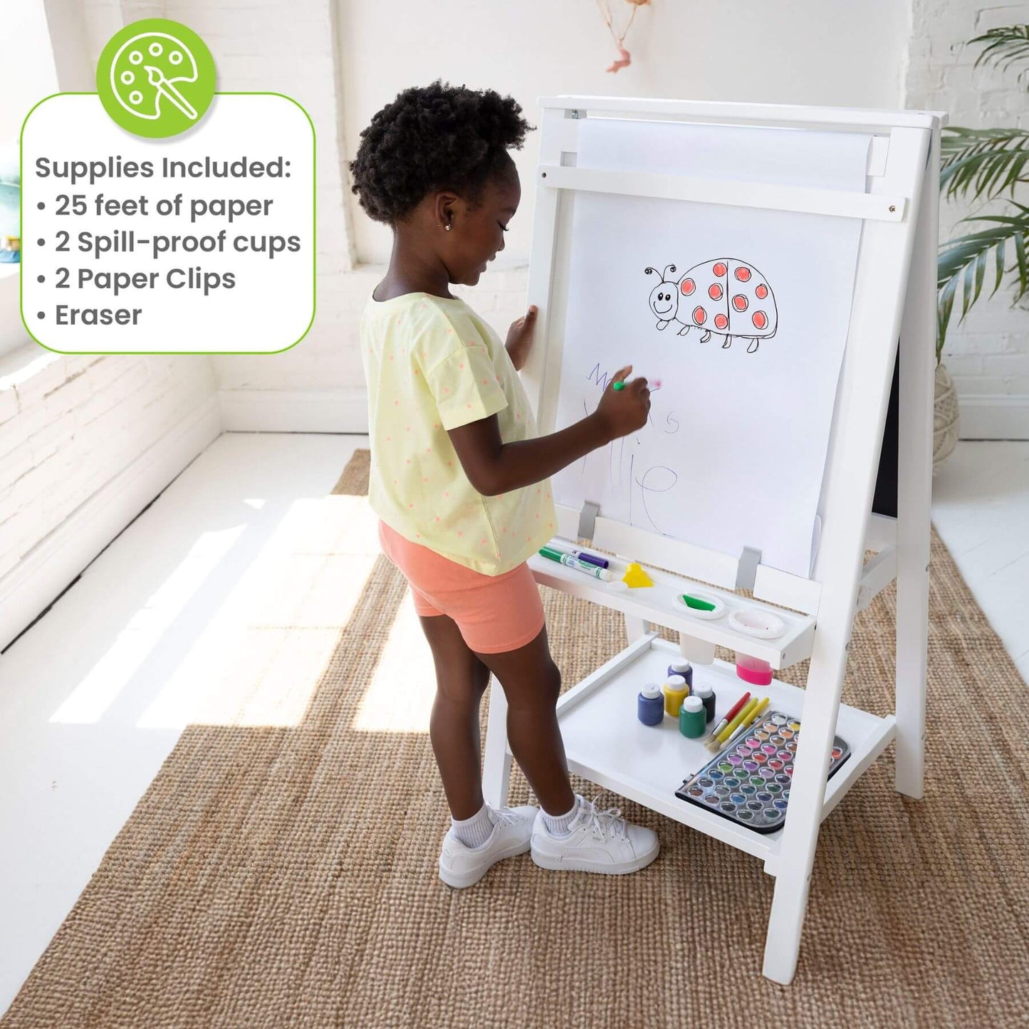 Child drawing on a Little Partners Folding Artist EZ Easel White with art supplies included