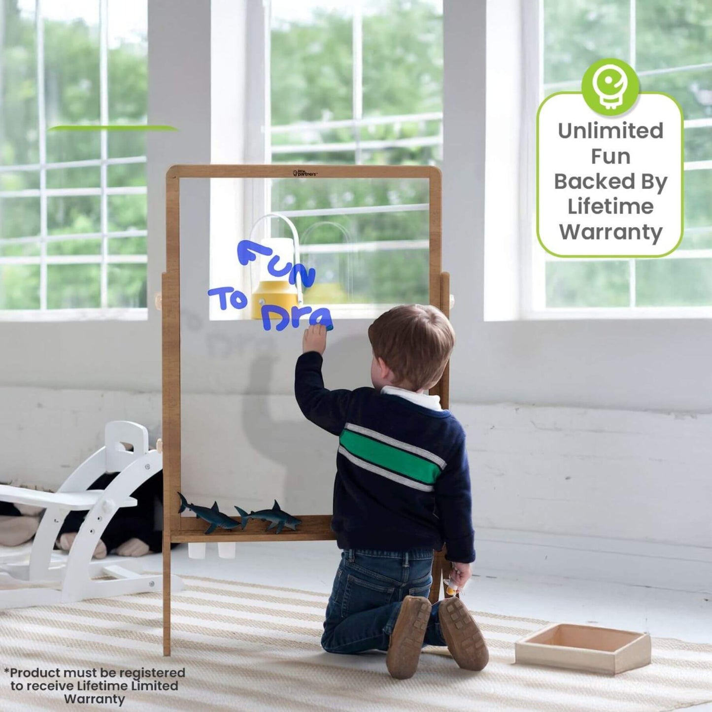 Boy Drawing on Little Partners Peek-A-Boo Easel Natural