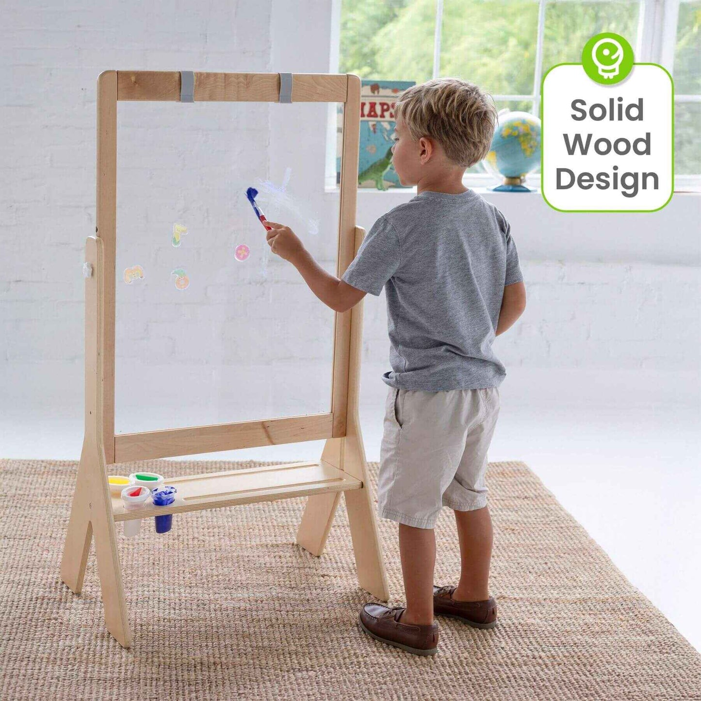 Boy Drawing on Little Partners Peek-A-Boo Easel Natural