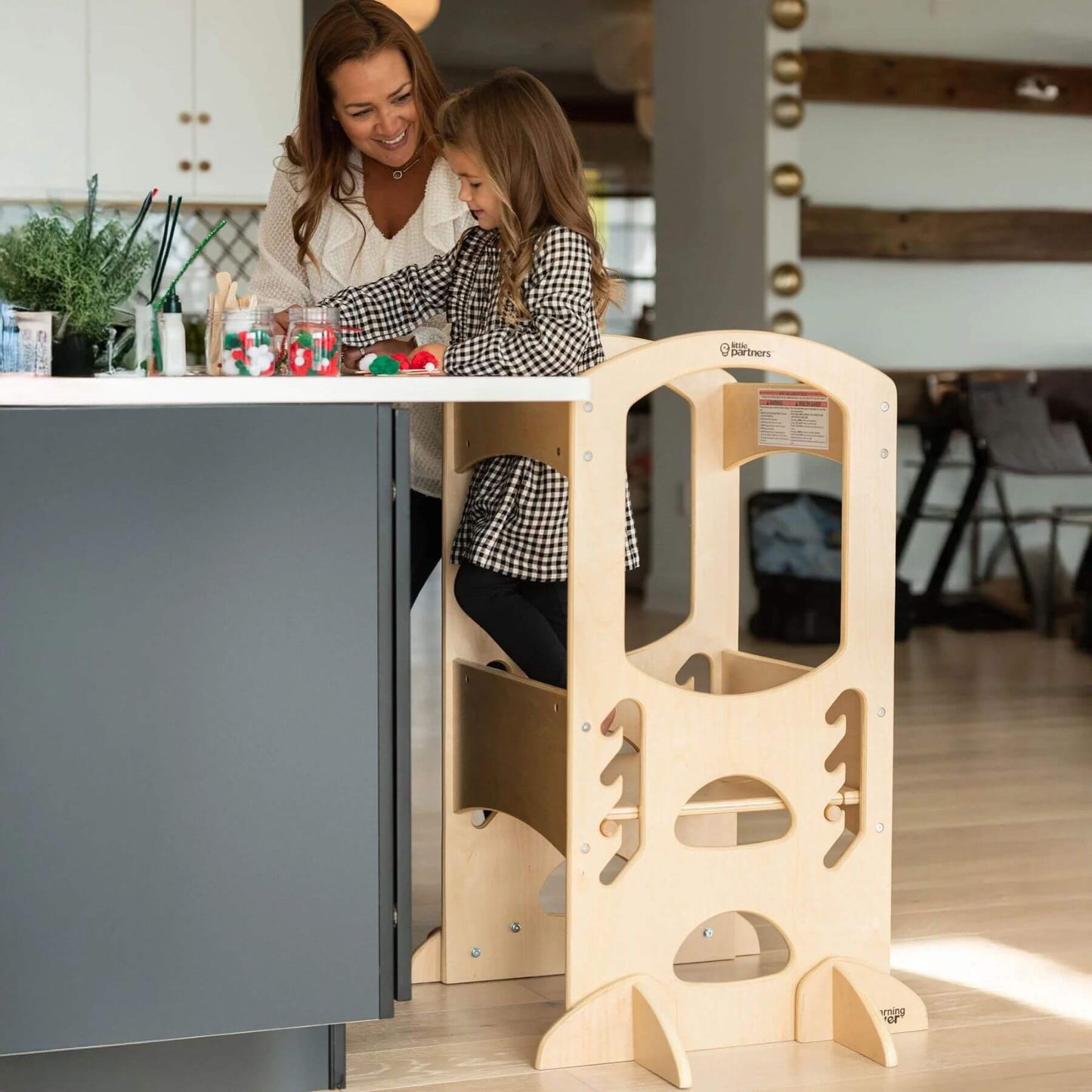Girl Standing on Little Partners The Learning Tower Natural, Playing Games with Mom