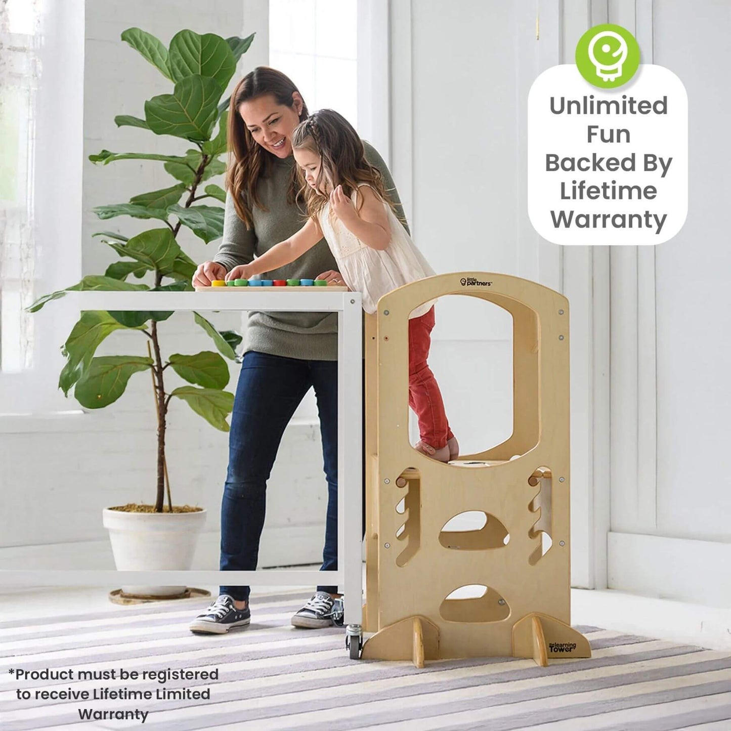 Girl Standing on Little Partners The Learning Tower Natural playing toy with Mom