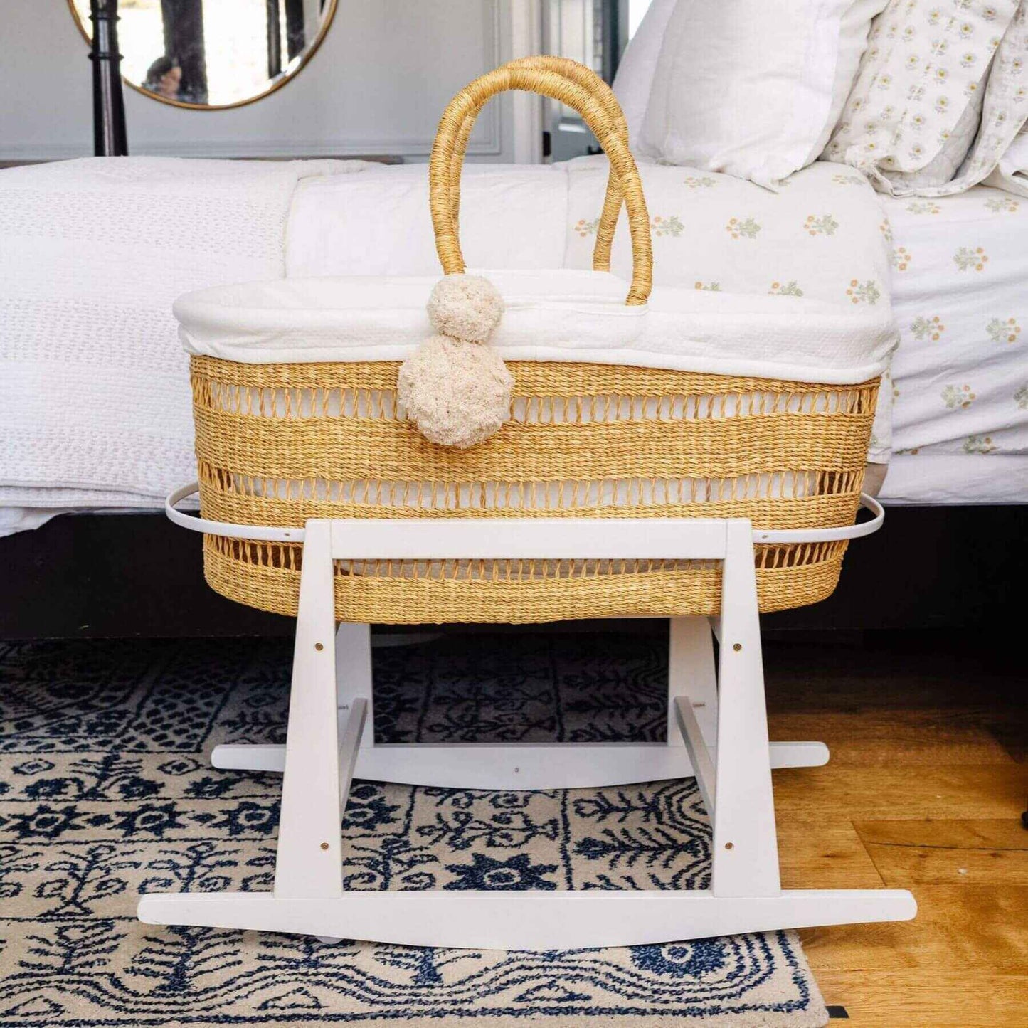 Modern Open Weave African Moses Basket Vegan Handle (No Hood) on a wooden stand in a bedroom setting.