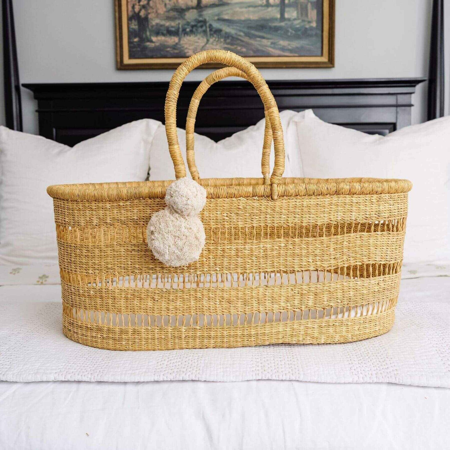 Modern Open Weave African Moses Basket Vegan Handle (No Hood) on a bed