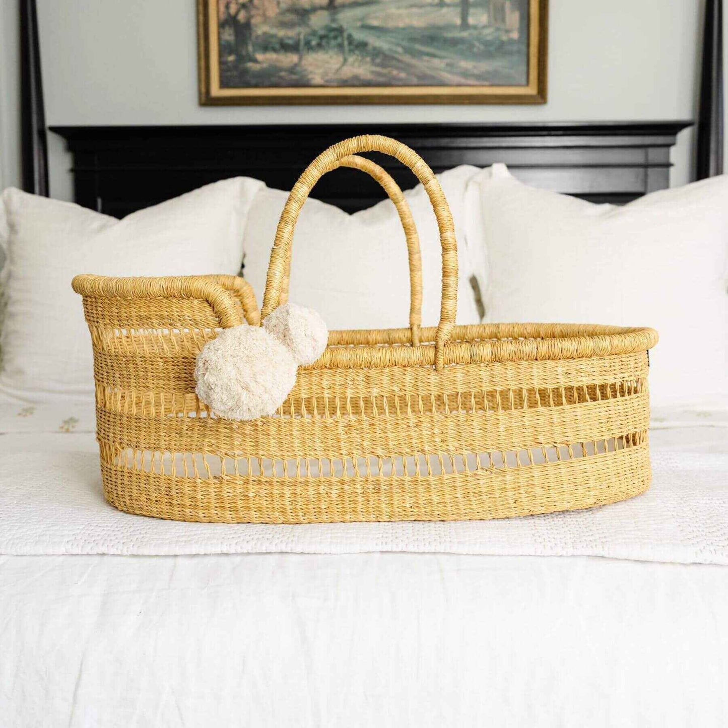 Modern Open Weave African Moses Basket Vegan Handle on a bed