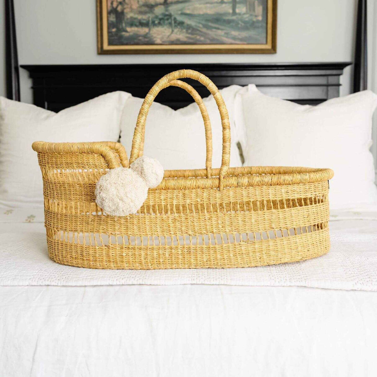 Modern Open Weave African Moses Basket Vegan Handle on a white bedspread