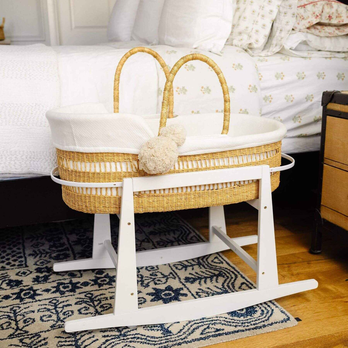Modern Open Weave African Moses Basket Vegan Handle on a stand in a bedroom setting