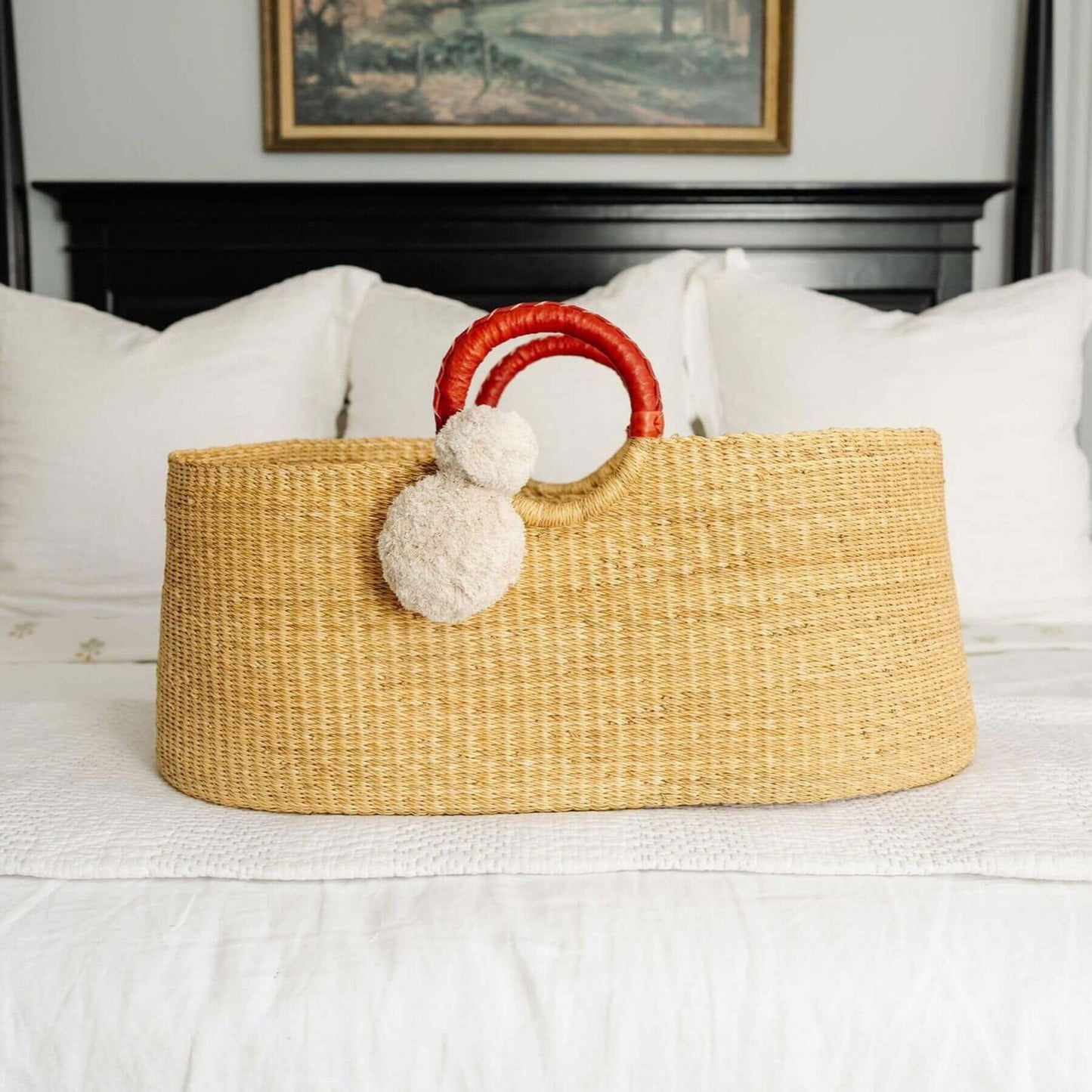 African Moses Basket Cognac Circle Handle on bed