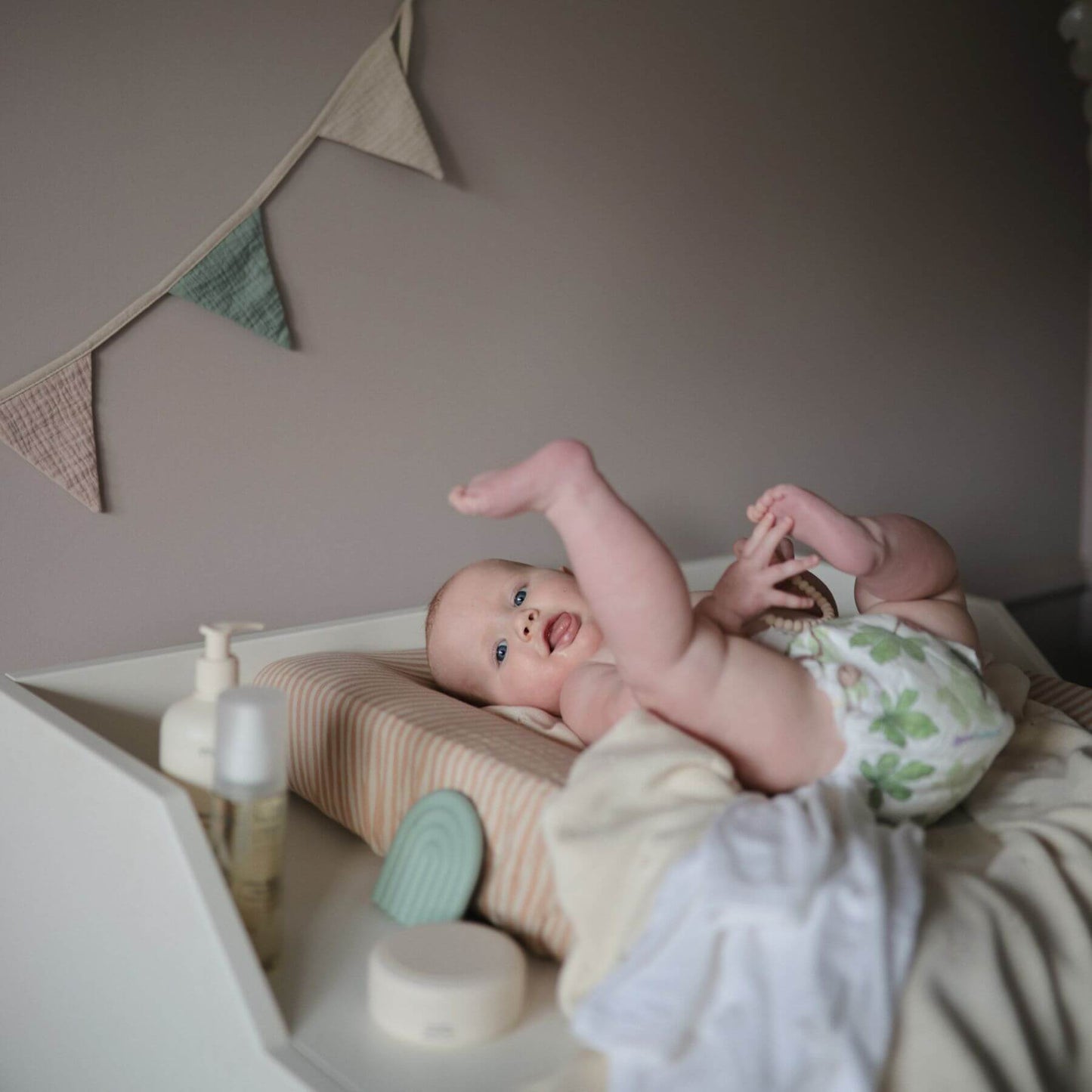 Mushie Organic Cotton Baby Garland on Nursery Room Wall