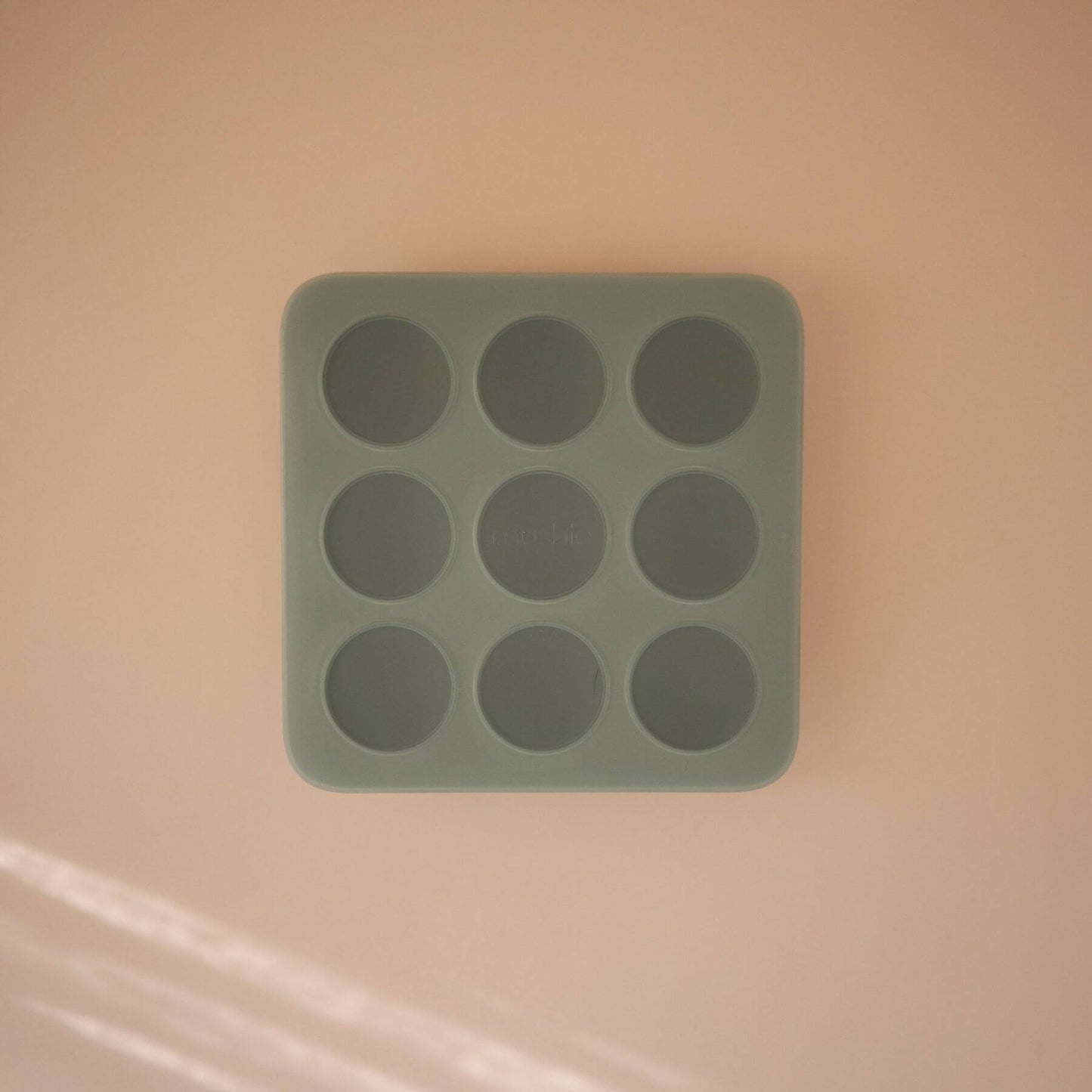 Mushie Baby Food Freezer Tray Cambridge Blue on a beige background