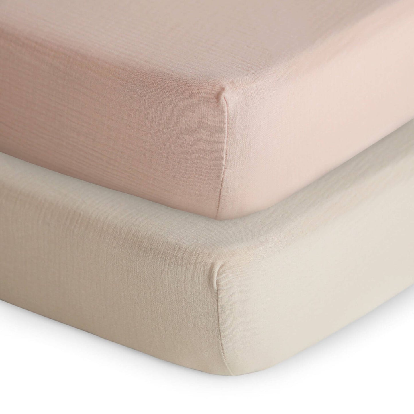 Two fitted mushie sheets in Blush and beige
