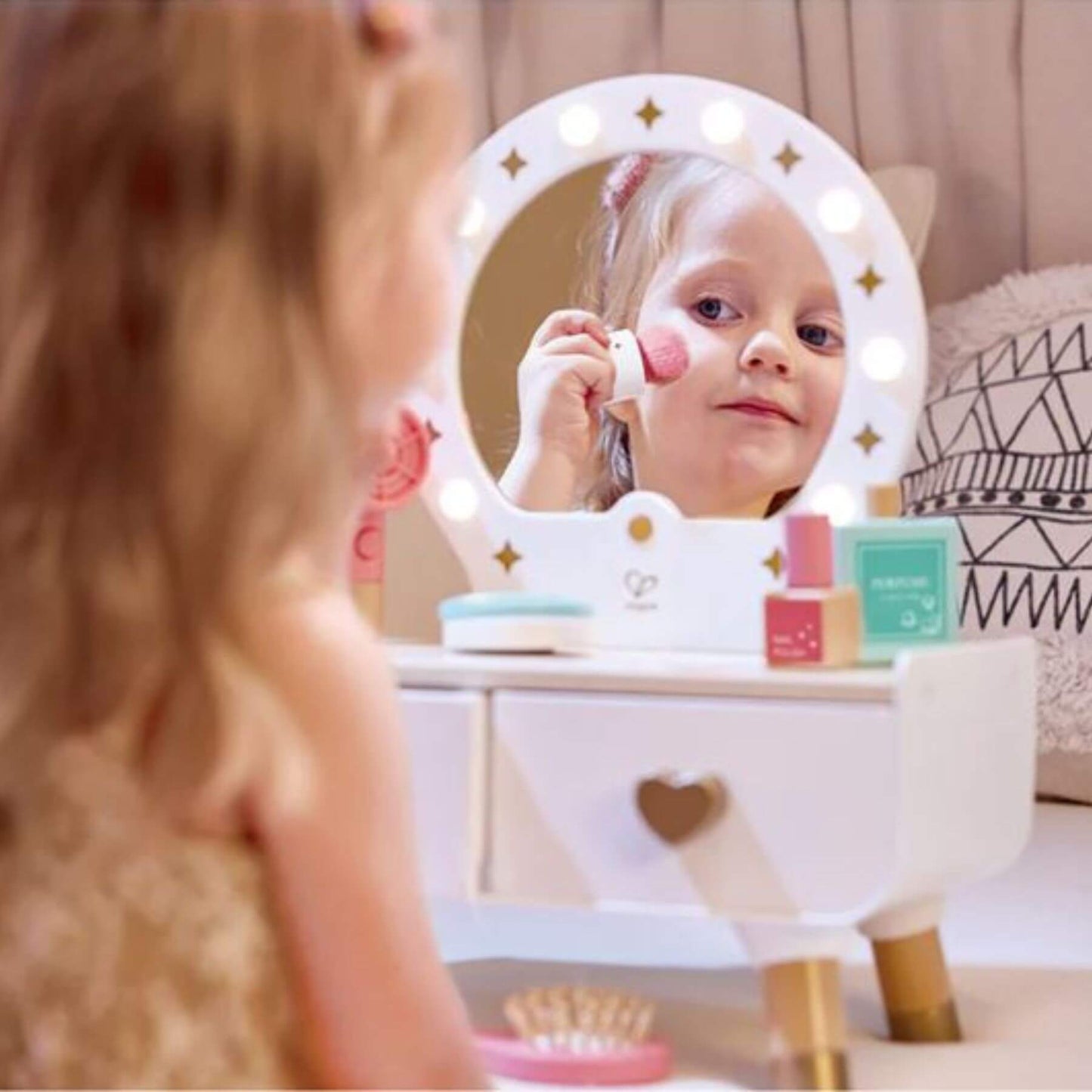 Girl Doing Makeup in front of Hape My Stylish Dressing Table