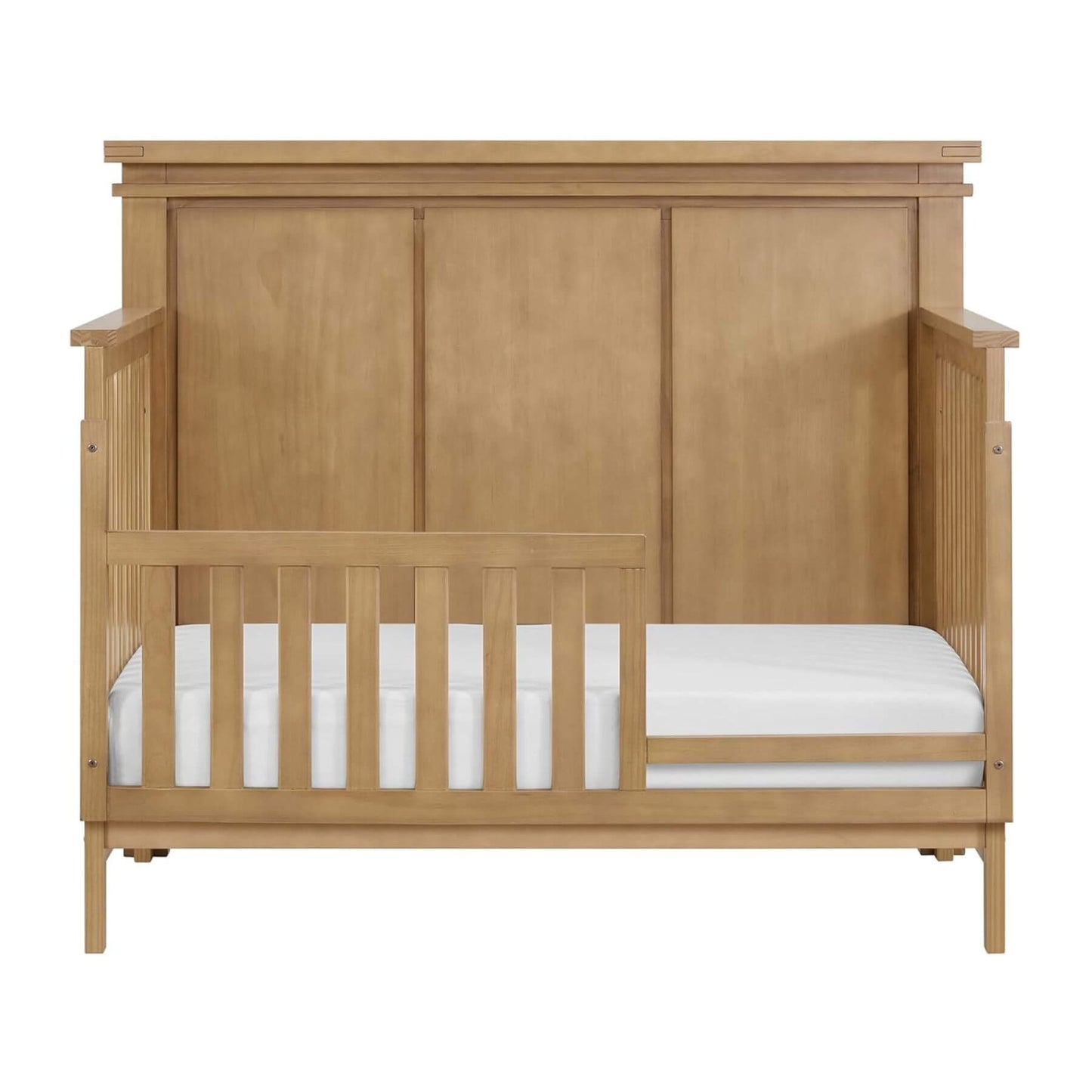Wooden crib with white mattress on a white background