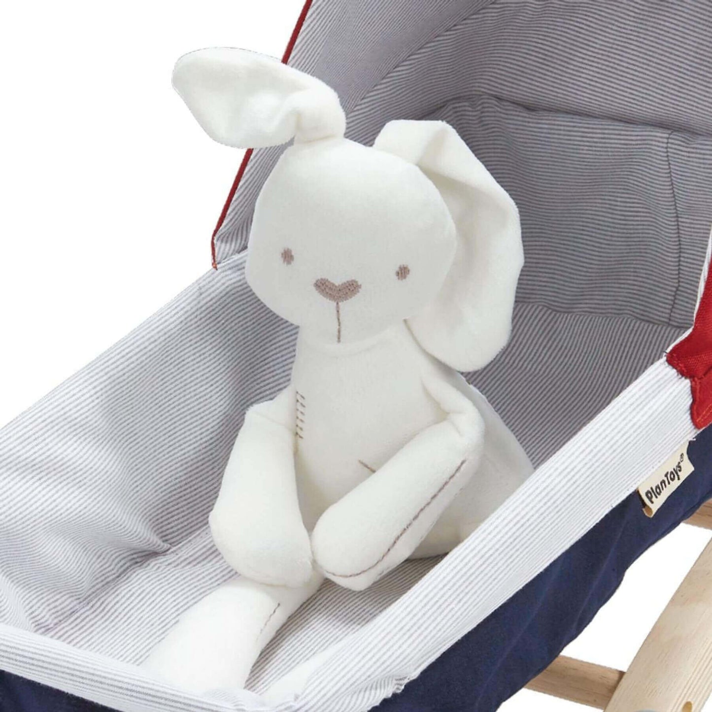 White plush elephant toy on PlanToys Doll Stroller