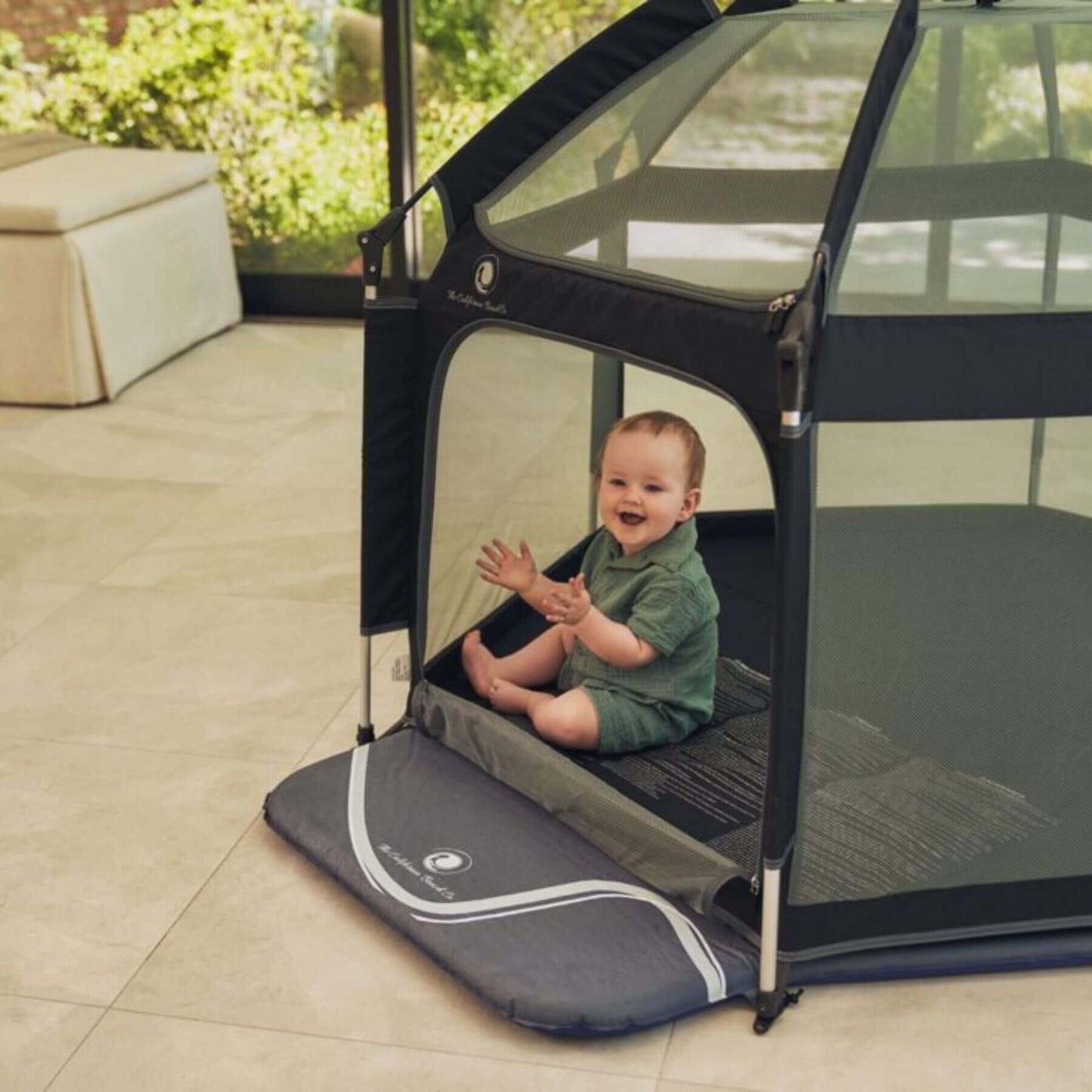 Baby Sitting inside Pop 'N Go™ Playpen Black