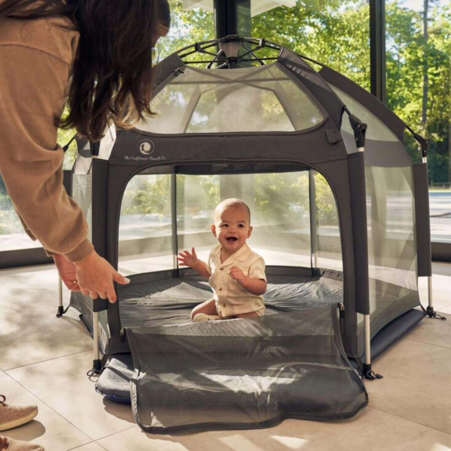 Baby Sitting inside Pop 'N Go™ Playpen Dark Gray