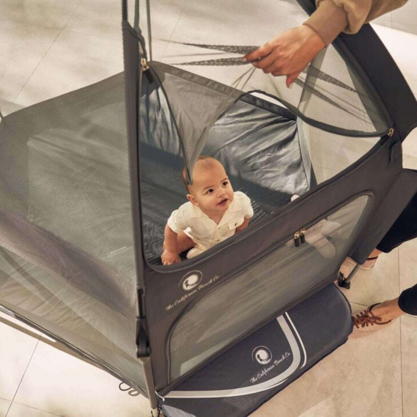 Baby Sitting inside Pop 'N Go™ Playpen Dark Gray