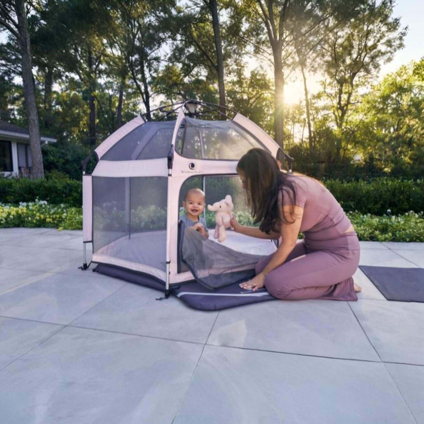 Baby Playing inside Pop 'N Go™ Playpen Pink, with mom