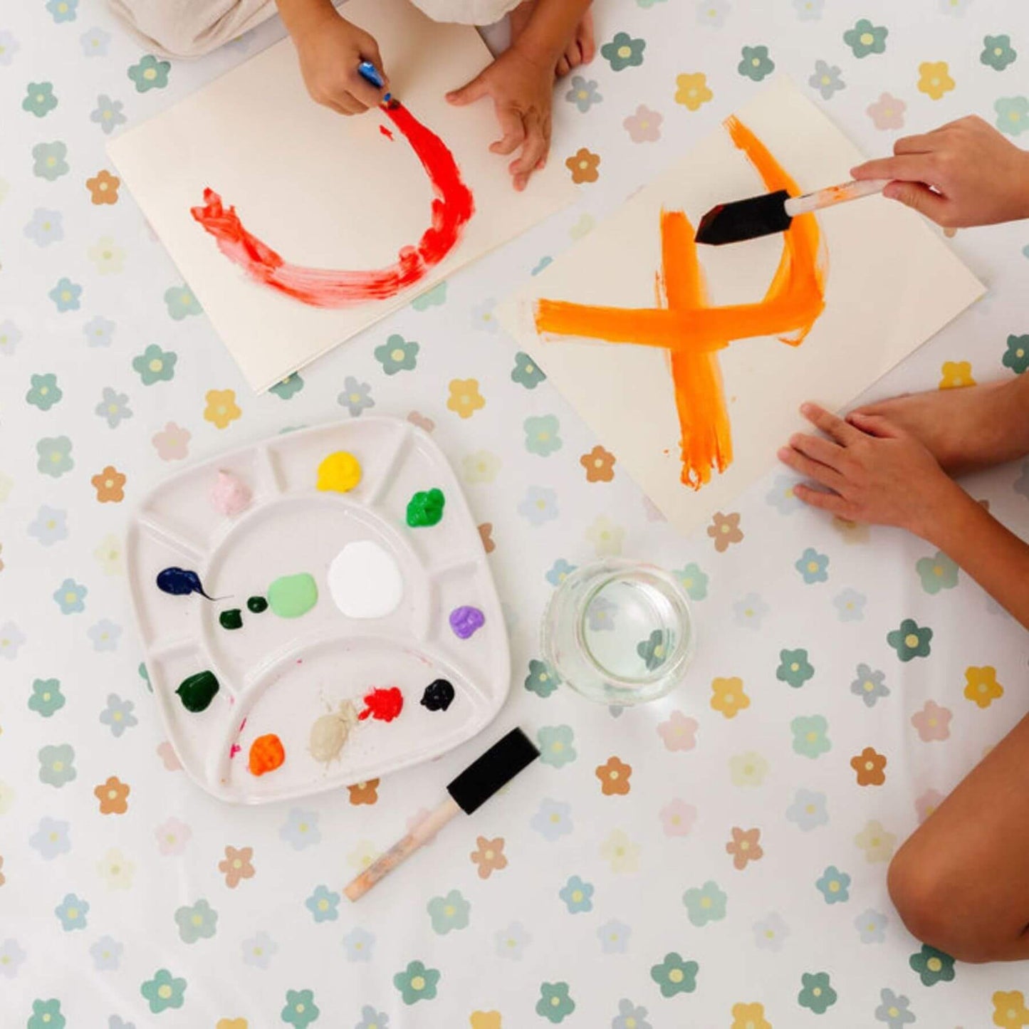 Children painting on Toki Kids Playful Posies Vegan Leather Mat