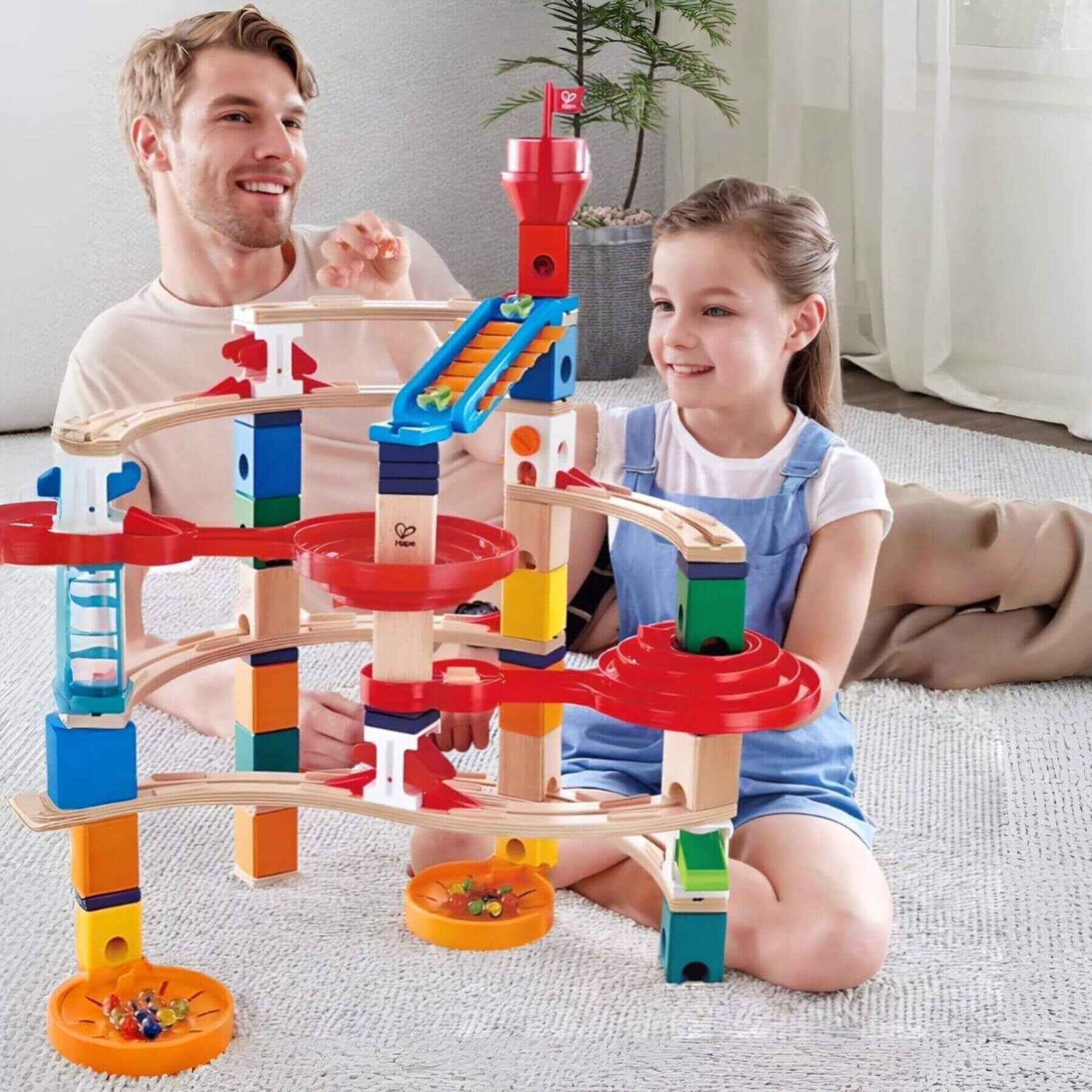 Dad & Girl Playing Hape Quadrilla Super Spirals Wooden Marble Run Blocks