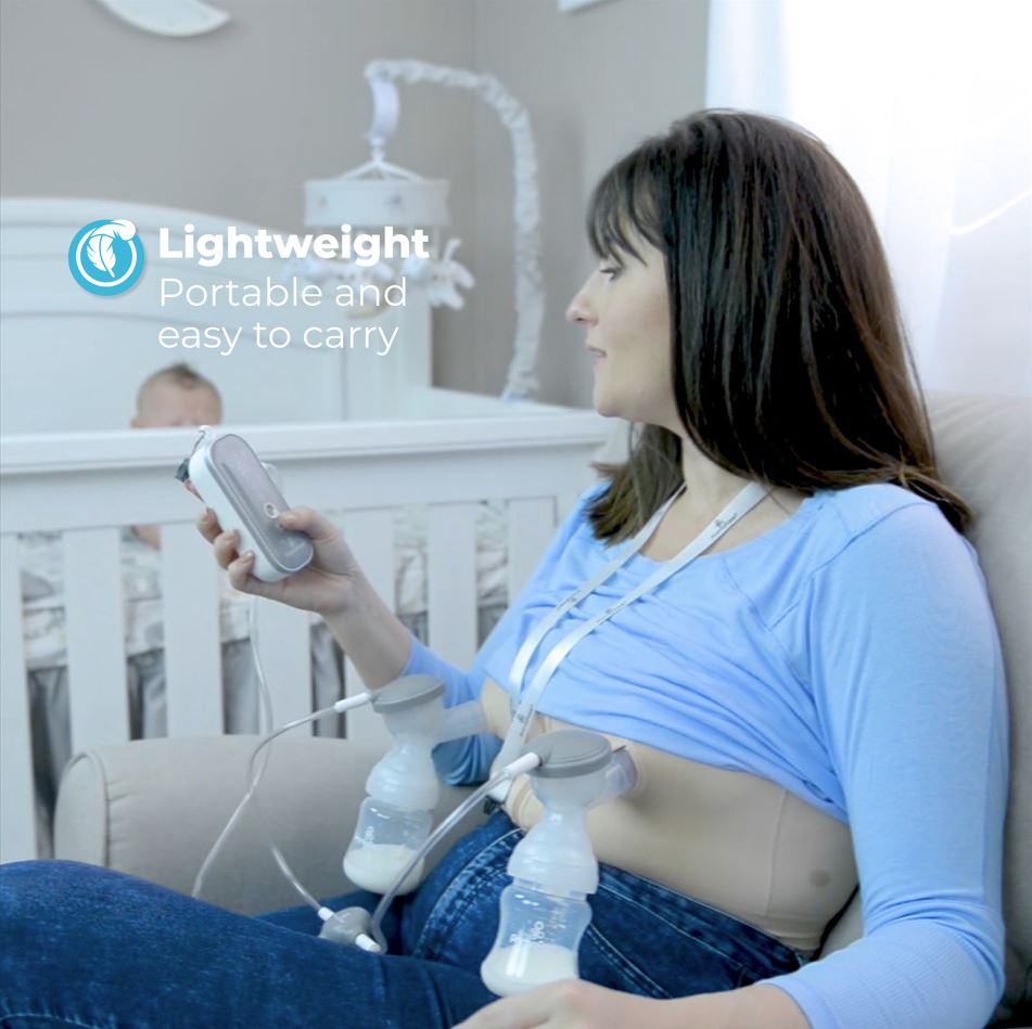 Woman using Primo Passi Portable Double Electric Breast Pump in a home setting