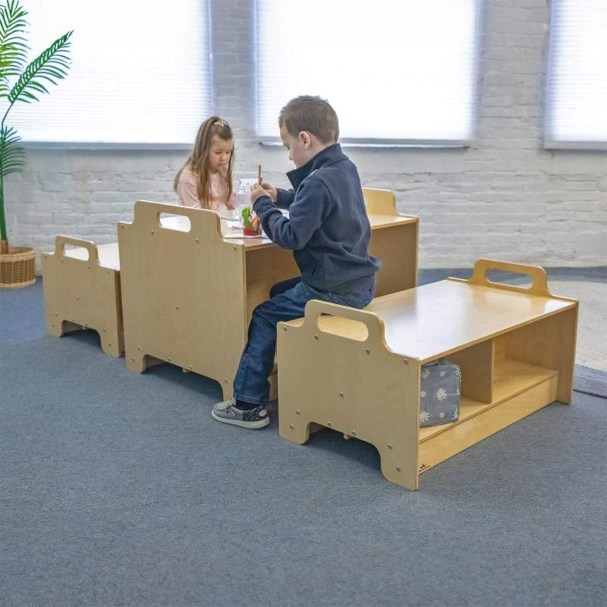 Two children sitting at Stack-Able™ Table in a classroom setting.