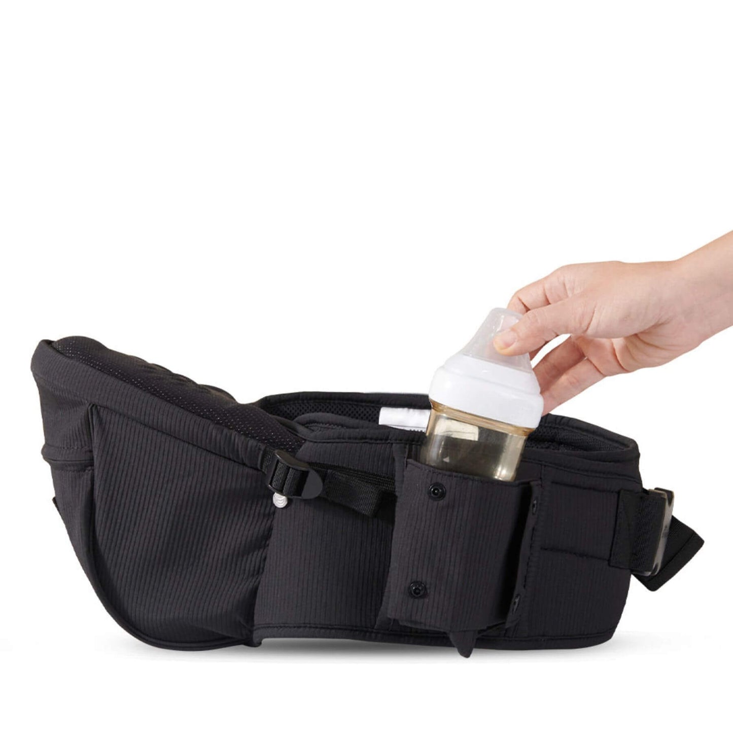 Sunveno Easy Hold Baby Hipseat Carrier with a hand placing a bottle into it on a white background