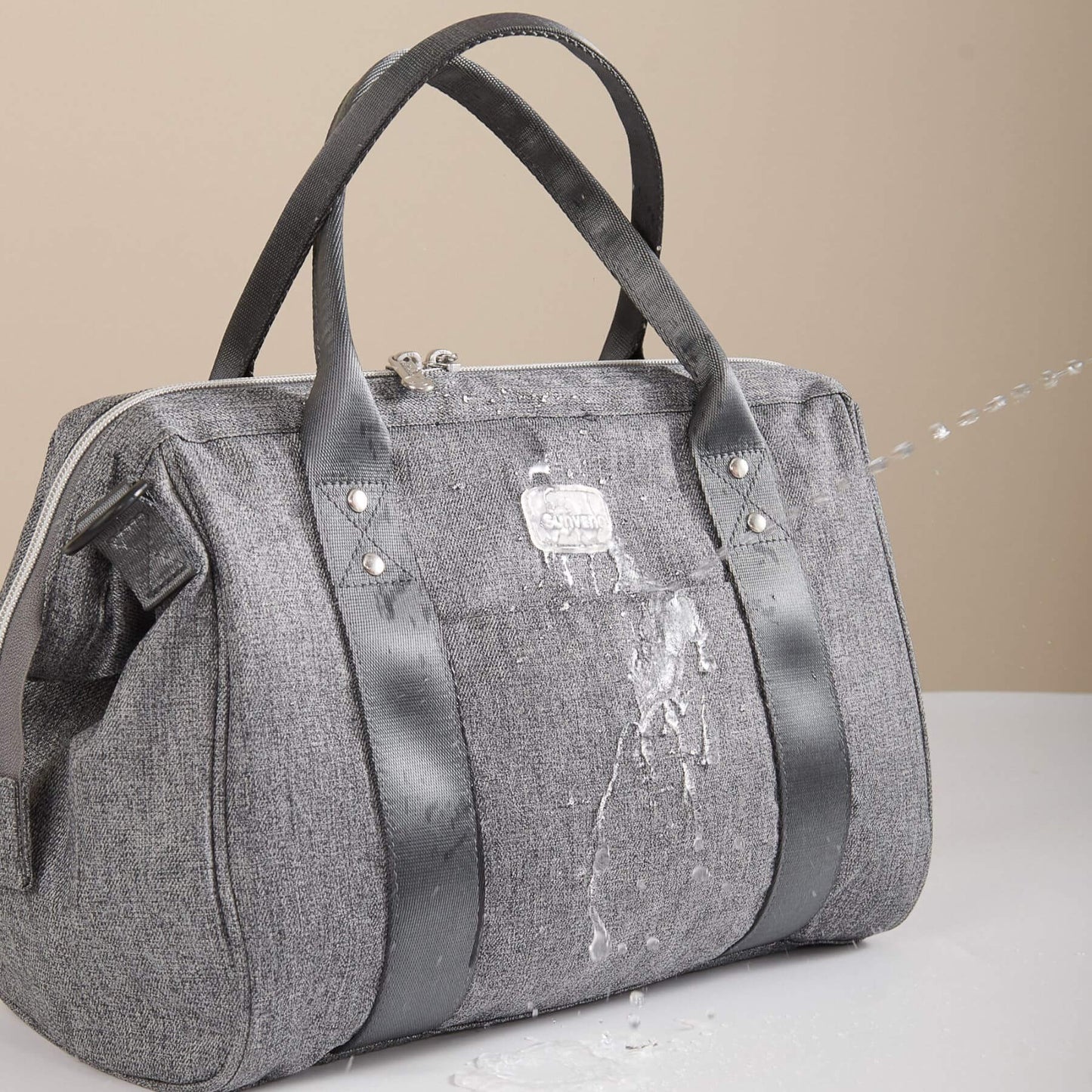 Sunveno Small Crossbody Diaper Bag on a beige background