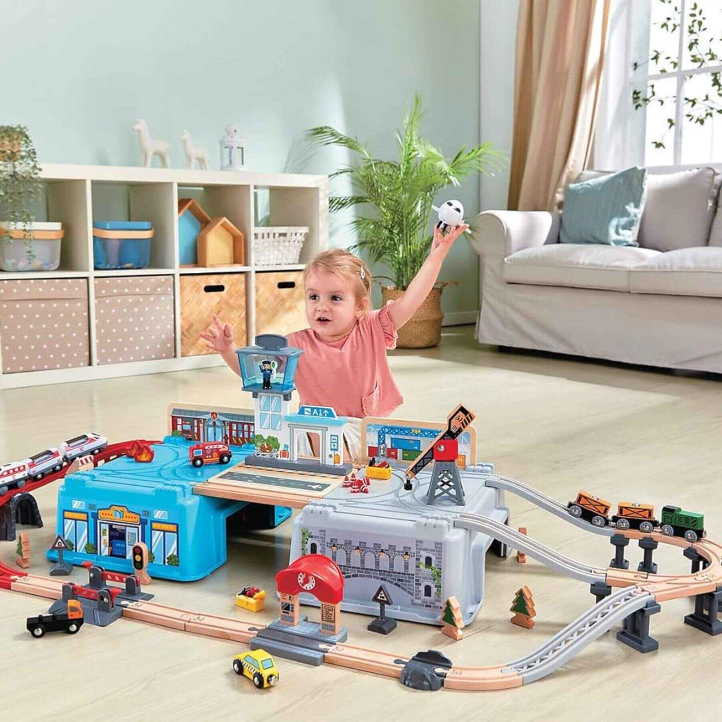 Girl Playing Hape Super Cityscape Transport Bucket Set