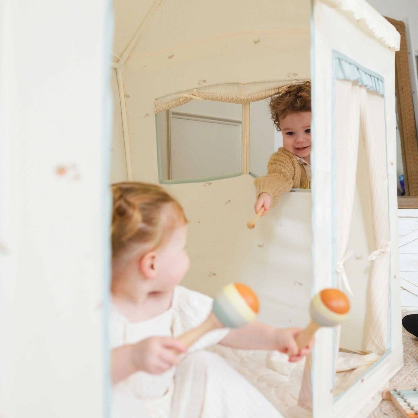 Two children playing with toys inside Tiny Land® Sweet Citrus Kid's Play Tent - Creamy white/blue.